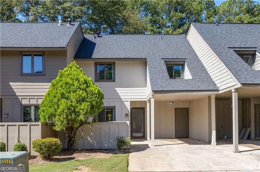 Welcome home to Cedar Canyon- a beautiful swim and tennis community surrounded by lush landscape, ideally situated within minutes of The Battery and I-75. This recently renovated unit includes two levels of light-filled space overlooking an expansive private greenspace. On the main floor, a spacious, updated kitchen is flanked by a private home office and a separate dining room which opens into the airy, two-story great room. An architectural niche allows for the perfect dropzone and even a bar and a separate powder room is perfect for guests. Upstairs, the open loft accomodates a  convenient laundry room and a second work from home space (or the perfect place for a Peloton). The primary suite features vaulted ceilings, a walk-in shower and a new vanity. The two ample secondary bedrooms each with private closet share a large hall bathroom.