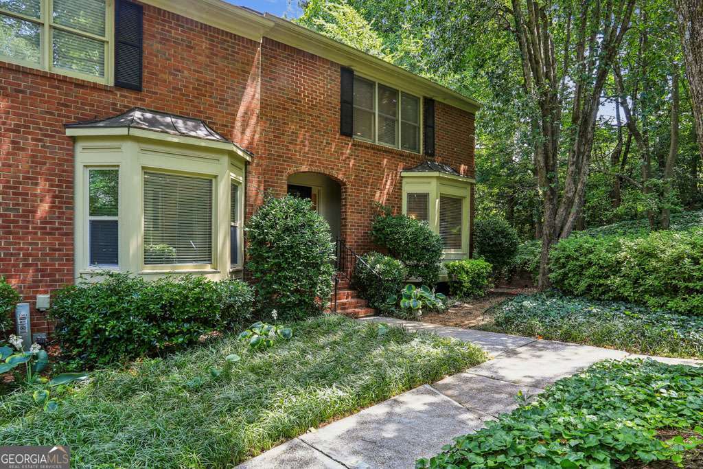 Welcome home to this beautifully maintained brick end unit townhome in desirable Sheffield Glen, an established community with lush landscaping and a serene setting. This home is situated at the rear of the community, lending it more privacy than other units. The interior layout of this townhome feels more like a single family home, with spacious rooms and multiple living spaces. The entrance foyer provides a glimpse into the main level of the home that offers an eat-in kitchen with hewned granite counters, stainless steel appliances and tile backsplash, plus a breakfast area with bay window. Step into the great room with a dedicated dining area as well as a large fireside living room. From here, you have access through the French doors to the incredible covered and screened deck that spans the entire width of the home. The primary suite and two additional bedrooms are upstairs. The primary bath features an oversized walk-in frameless tile shower, while the hall bath has been updated with a new vanity counter. Finally, the heated and cooled terrace level offers a finished family room plus a large utility/storage closet with utility sink. This home provides an abundance of storage options in the basement, 2-car garage, and pull-down attic. The owner had a water spigot added to the screened deck for convenience. Sheffield Glen has a dog walk area at the front of the community as well as abundant guest parking. The community is conveniently located off of Briarcliff Rd near the CDC, CHOA, the VA, multiple Emory locations, plus virtually unlimited dining and shopping options. Close proximity to major roads and highways. Not FHA or VA approved.