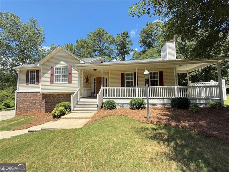 Charming 4-Bedroom Home on 1.47 Acres - Perfect for Spreading Out! Looking for space, location, privacy, and a layout that just makes sense? This 4-bedroom, 3-bath home sits on a flat and private 1.47-acre lot with plenty of room to park, play, and relaxing. From the moment you arrive, you'll love the charming curb appeal with a large front porch ideal for morning coffee or relaxing evenings. Step inside to an open-concept living space featuring vaulted ceilings and a beautiful stone fireplace with gas logs in the living room-creating a warm, cozy centerpiece perfect for gatherings or quiet nights in. The primary suite boasts a private en-suite bath and a generous walk-in closet, offering a peaceful retreat at the end of the day. The terrace level is a great bonus-set up as a in-law / Teen suite includes a bedroom, living room, full bath and wet bar perfect for guests, older kids, or extended family. It's a flexible space that gives everyone a little extra room and privacy. The oversized level backyard is ideal for a garden, fire pits, pets, or even room for a pool. And with tons of parking, you'll never have to worry about space for family or guests. This home offers the freedom of space with the modern conveniences of an open floor plan and thoughtful design touches throughout. Best of all-no HOA, and the location is hard to beat! You're just minutes from shopping, dining, the hospital, and I-20 for an easy commute.