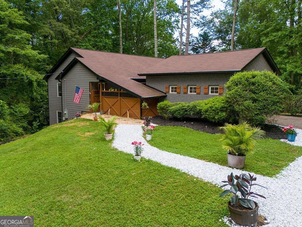 East Cobb Gem about to hit the market in the middle of May. This beautifully rebuilt 3 bedroom, 2 bath ranch on full unfinished basement is about to wow your socks off. It is in the heart of East Cobb close by I-75. The trifecta of schools Murdock, Dodgen, Walton. A rare find that blends charm, convenience, and modern upgrades. Inside you will find a spacious open concept layout designed for entertaining. The bright and airy living space flows seamlessly. It was fully rebuilt from the ground up just 4 years ago. The full unfinished basement is stubbed for a bathroom and walks right out into a large wooded yard. The front courtyard is your own private escape. Drink your morning coffee or your evening wine with only the sounds of nature. This is an excellent property for anyone looking to get into the best East Cobb schools! Move in ready! Roof, windows, HVAC, water heater, appliances are all 3-4 years old.