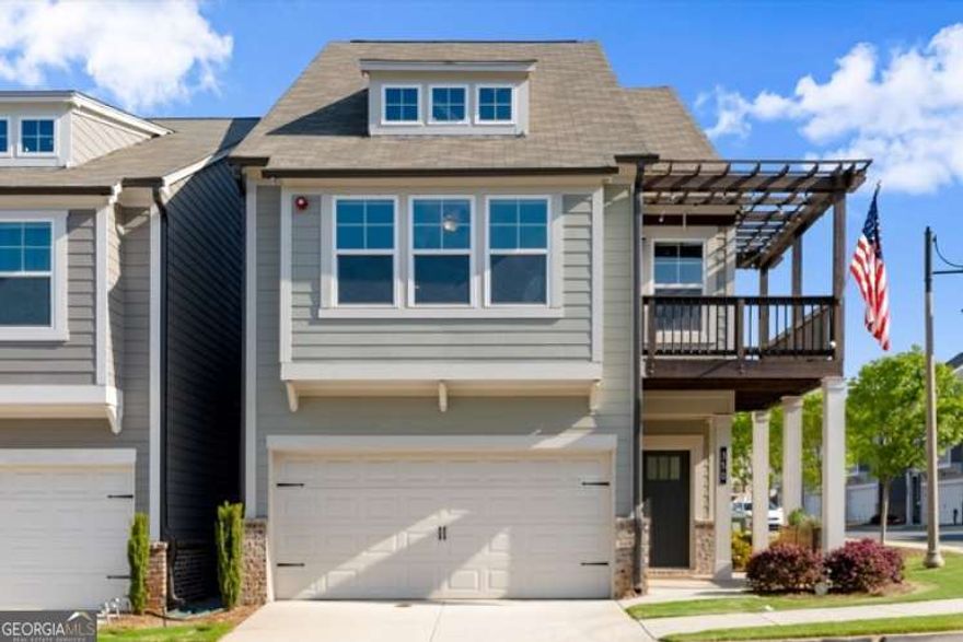 Motivated Sellers!!! Immaculate turn-key ready home waiting just for you! This is a rare corner unit, Athena floorplan with 4th bedroom option, plus beautiful views from the primary suite and balcony. Don't miss it! Over $99,000 in builder upgrades. Sleek and modern. Quartz throughout, frameless shower, larger walk-in closets, 5" hardwood floors, solid oak stairs, professional EPOXY garage floor. Breathe easy with whole house Broan air purification system. Huge & Spacious! Open floor plan with nice light kitchen, dining and living room with fireplace and built-ins. Second floor are the bedrooms; the primary suite has an amazing walk-in closet with a window and a romantic private balcony and gorgeous upgraded bath. Third floor is the fun floor! A spacious bonus/bedroom for cozy movies, gym, office, play room... whatever you need, with it's own bathroom and closet. Semi-detatched, maintenance free living near downtown Woodstock only a few miles away to enjoy shopping & dining with all your extra free time.