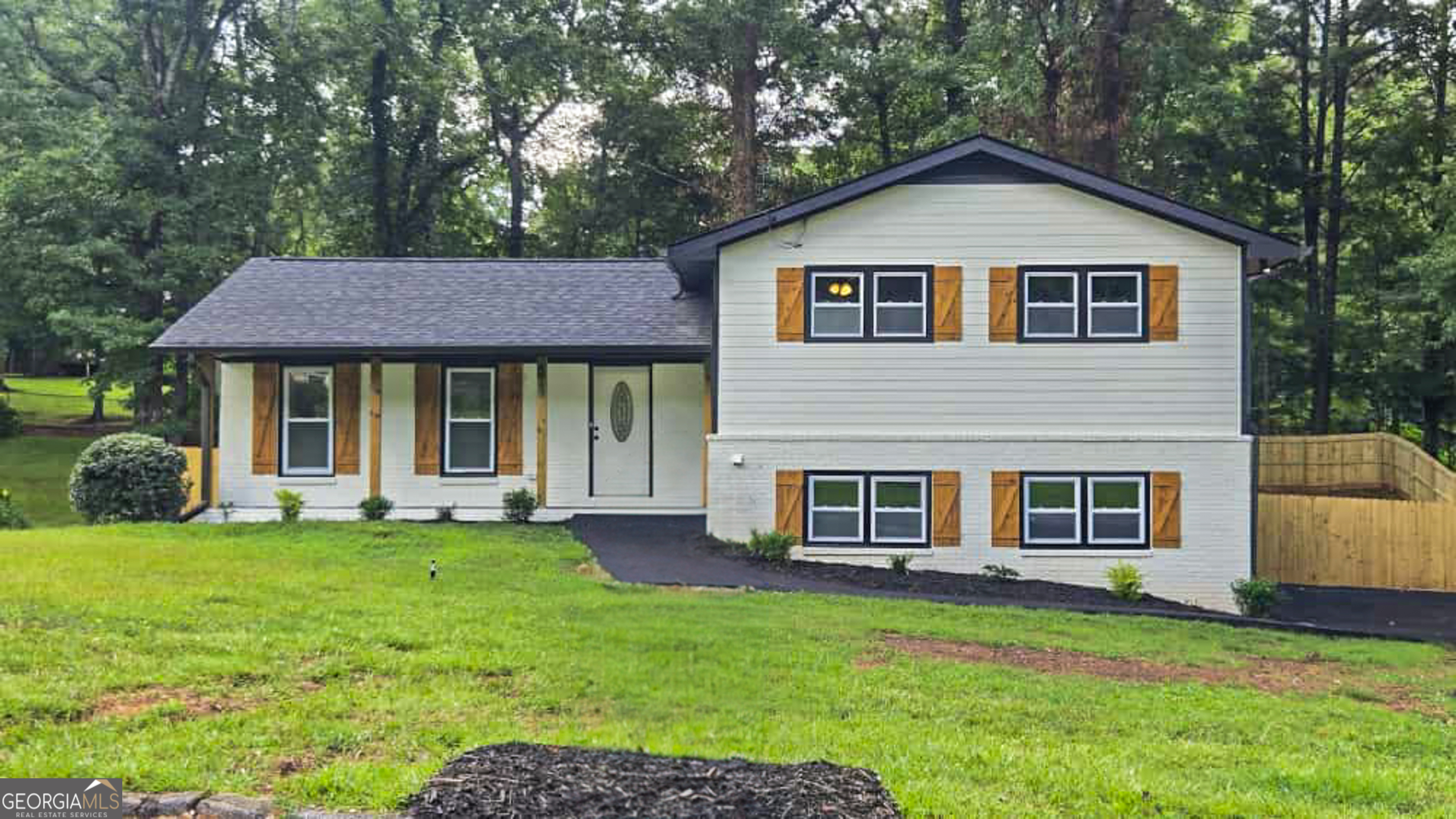 Fully Remodeled & Move-In Ready, Better Than New! This stunning home has been completely redone with high-end finishes and upgrades throughout. Enjoy peace of mind with a new roof, siding, gutters, windows, doors, HVAC, plumbing, electrical, and water heater all brand new. The home features a fresh driveway, new shed, new fence, and a sunroom with a brand-new deck, perfect for entertaining. Inside, you'll find all-new subfloors, flooring, carpet, LVP floors, and garage door openers. The kitchen and baths shine with new cabinets, countertops, appliances, light fixtures, faucets, and beautiful tile in showers and tubs. Offering 4 beds, 3 baths, a spacious layout, including a room with a full bath on the lower level perfect for rental income potential, Sitting on a generous half-acre lot, the outdoor space is ready for your personal touches-ideal for entertaining or future enhancements.. Don't miss the chance to make this house your new home!