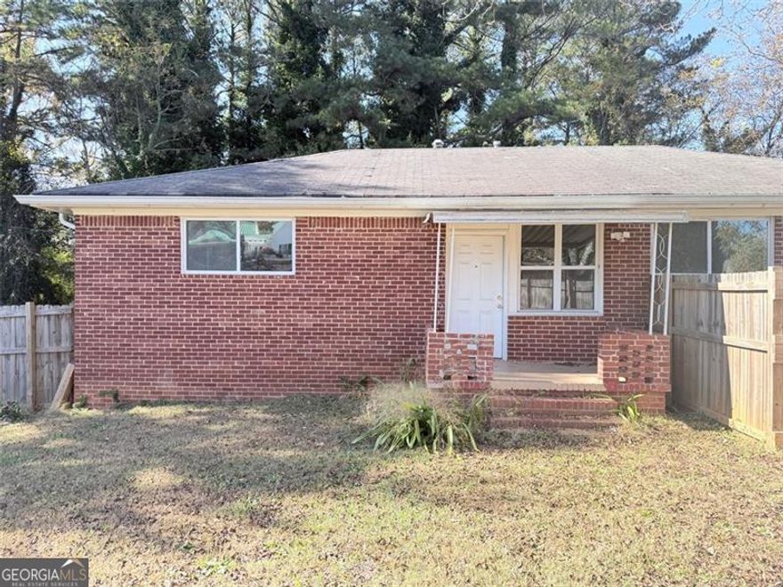 Welcome to this lovely all-brick 4-bedroom, 2-bathroom home situated on a large 1.24-acre corner lot in McDonough! This charming property offers both privacy and visibility, located at an intersection with easy access to I-75, shopping, and restaurants. The fenced front yard provides added security and outdoor enjoyment for kids, pets, or gardening.  Inside, you'll find a bright living area, a functional kitchen, and a comfortable layout perfect for everyday living. The finished basement adds valuable flexible space, featuring its own kitchen and full bathroom. A built-out suite with a private entrance makes it ideal for extended family, guests, or additional living arrangements.  The spacious, level lot offers plenty of parking and outdoor space for gatherings or future improvements. The surrounding area is also seeing exciting growth, with new retail and community developments planned nearby along SR-155 and McDonough Parkway. Upcoming shops and road enhancements are expected to bring even more convenience and visibility to the neighborhood.