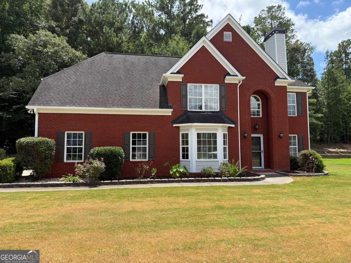 Come see this stunning home in the convenient south Cobb community of Mount Gerizim Crest offering a clubhouse, pool, playground, and no through traffic in the subdivision! This charming residence sits on a large, level corner lot with an outbuilding for extra storage. New carpet and fresh paint inside and out give this home a bright, inviting feel as the recent upgrades enhance both aesthetics and functionality. Step into this modern kitchen with luxurious granite countertops that exude sophistication and gleaming new stainless steel appliances, while the eat-in breakfast area invites you to enjoy your morning coffee in comfort. With easy access to Hartsfield-Jackson Atlanta International Airport (15.4 miles away), Providence Pavilion shopping center (home to Publix and various retail/dining options), and Mable House Barnes Amphitheatre for concerts and events, this beautiful residence offers an inviting atmosphere and a convenient location, making it an ideal place to call home.