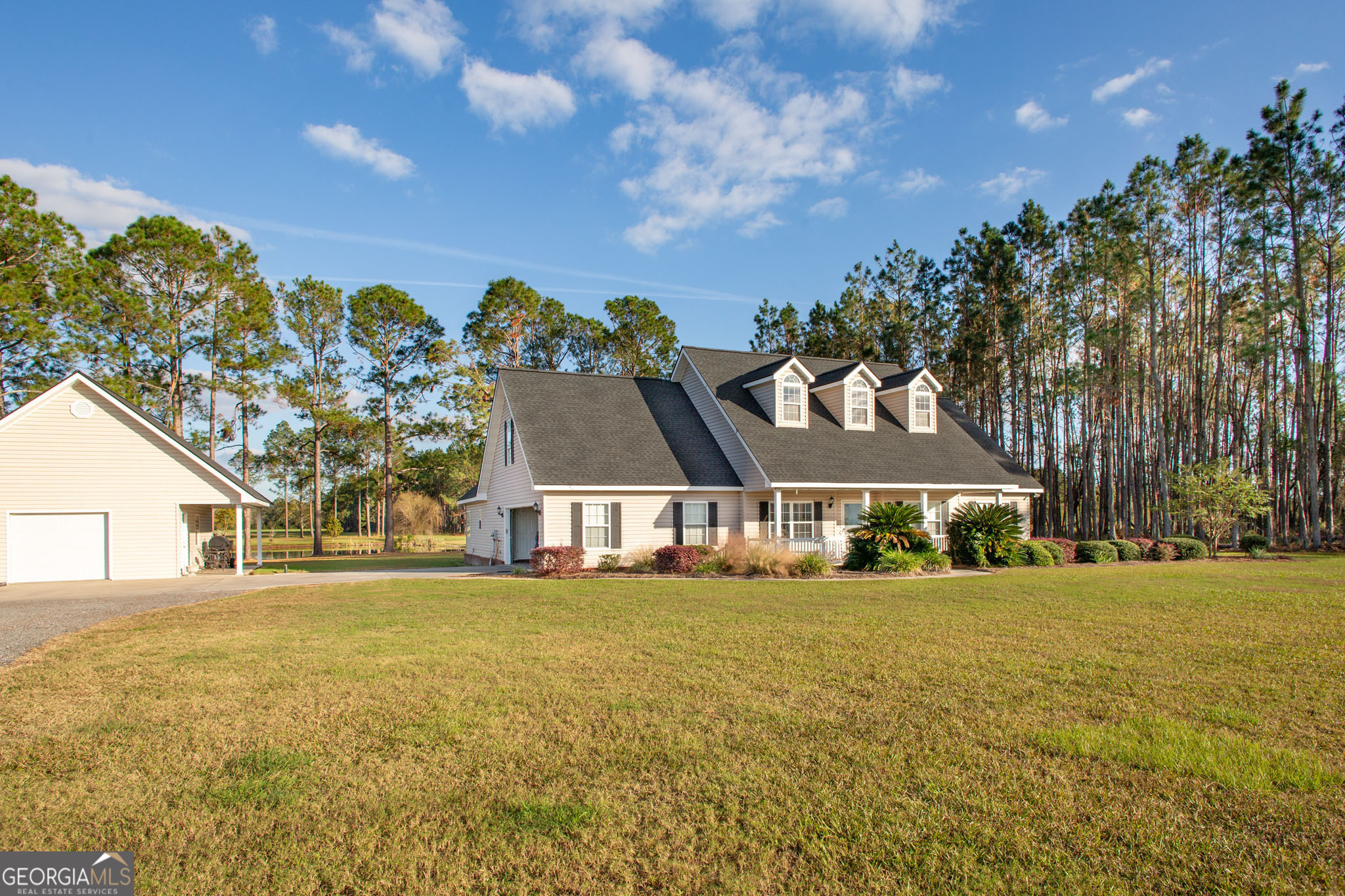 Introducing the property of your dreams! This stunning 5 bedroom, 3 bathroom home is nestled on a gorgeous 2.05 acre lot. Built in 2001, this blend of modern living and peaceful nature was renovated in 2023. Once inside the home, you will discover an open-concept layout with a bonus room that provides privacy for a teen or mother in law. The living, dining and kitchen areas are conducive to entertaining or spending a quiet weekend at home. The kitchen features luxurious quartz countertops that complement the stylish cabinetry and stainless steel appliances. Each bedroom is equipped with spacious closets that offer ample storage. The home is equipped with 2 AC systems as well as new appliances and a roof (both are less than 2 years old). The attached 2-car garage provides convenience and security. In addition to the attached garage, the property contains an additional 2 story garage detached from the home. This space is perfect for housing mowers/ATVs/additional outdoor equipment or a wonderful opportunity that could be transformed into a mother-in-law suite. The backyard is a true retreat. Accessible from the living area, the back patio features a view of the 2 acre pond. This exceptional property presents an incredible opportunity to own a home that includes modern comforts and amenities in a tranquil setting. Don't miss your chance to experience this remarkable property. Be sure to schedule your private tour today!