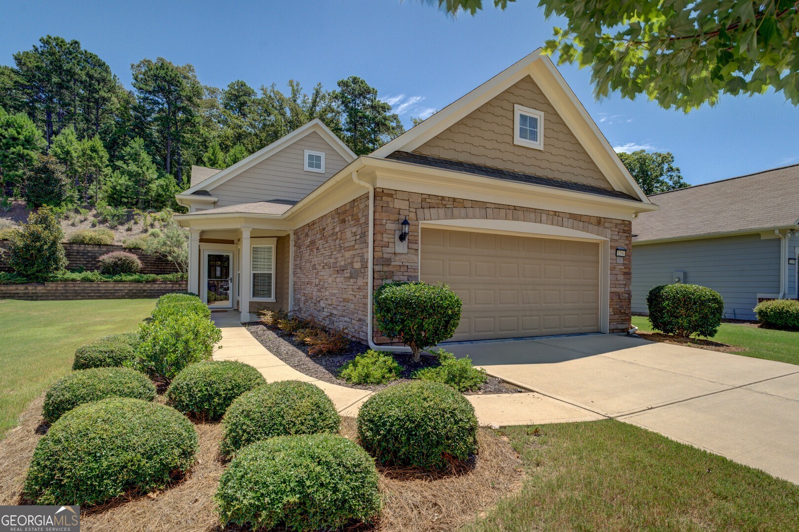 Discover the epitome of active adult living in this charming 2-bedroom, 2-bathroom ranch-style home at 1190 Branch Creek Way. Located in the Del Webb at Lake Oconee community on the shores of Georgia's second-largest lake, it offers a gated haven for those 55 and better. With 1,422 square feet of open-concept design, this home features a spacious kitchen, bright living areas, and an owner's suite with modern finishes. The seller is offering $5,000 towards closing costs or upgrades to personalize your space. Residents enjoy resort-style amenities, including a 21,000-square-foot clubhouse, indoor and outdoor pools, state-of-the-art fitness center, tennis and pickleball courts, bocce ball, arts and crafts studio, and miles of walking trails. Direct lake access-featuring 1,400 feet of shoreline, boat docks, ramps, and storage-supports an effortless waterfront lifestyle for boating, fishing, and water sports. A full-time activities director coordinates vibrant social events, clubs, and fitness programs, fostering a sense of community among neighbors. Conveniently located less than two hours from Atlanta, near shopping, dining, healthcare, and high-end resorts, yet enveloped in natural beauty with preserved green spaces. This low-maintenance, golf-cart-friendly paradise offers energy-efficient homes and round-the-clock security, perfect for an engaging retirement.