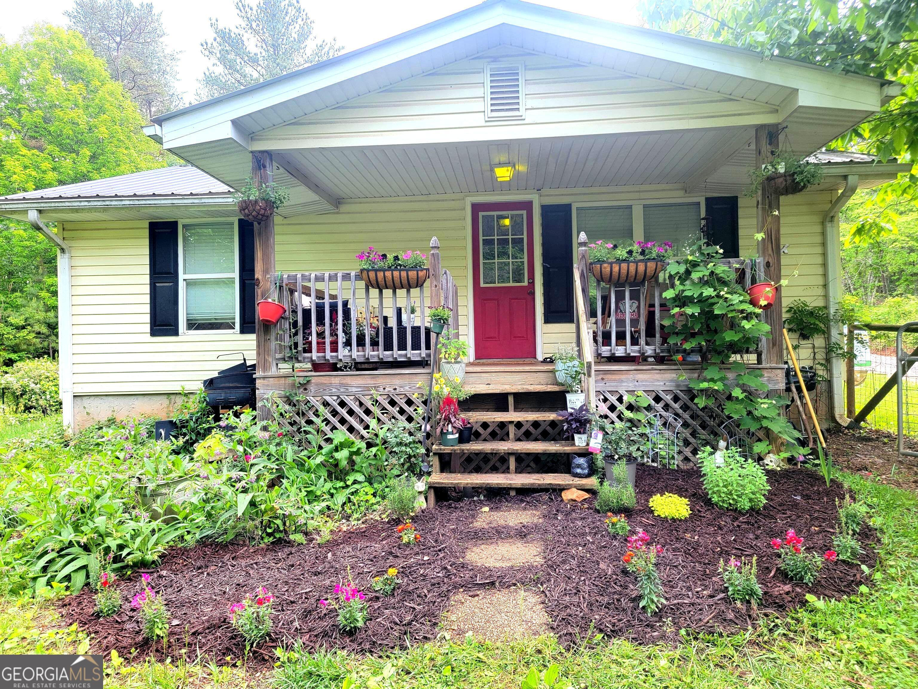 If you're looking for a home close to town and amenities, this adorable ranch is a must-see! Situated on nearly an acre, this 3-bedroom, 1-bath home features double sinks, an eat-in kitchen, and a versatile bonus room. The fenced yard offers plenty of space, with ample parking in the back and room to add a garage in the future. Enjoy your morning coffee on the covered porch while soaking in the peaceful country setting. With central HVAC, a durable metal roof, and abundant natural light, this home provides both comfort and charm. Don't miss this fantastic opportunity!