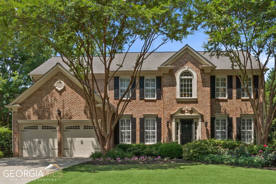 Prepare to fall in love with this elegant home in the coveted Longlake subdivision in South Forsyth. This immaculate, original-owner home has been lovingly maintained and beautifully updated with custom plantation shutters throughout. Gorgeous upgraded flooring leads through the main level of the home and into an inviting family room with vaulted ceilings and a gas log fireplace. You'll love the bright and airy kitchen with an abundance of white cabinetry, granite counters, an island, and a view of the large backyard! This thoughtfully-designed floor plan also includes a flex space AND a dedicated office with built-ins on the main level. Upstairs, you'll find a luxurious primary suite, which features a spacious bedroom and bath with separate vanities, a large soaking tub and a frameless shower. There are three generously-sized secondary bedrooms and another bath, updated with double sinks, quartz counters, and beadboard paneling. The expansive finished terrace level provides a full kitchen, a dining area, a huge game room/family room, a bedroom and full bath, and a home theater! Outside, you'll enjoy a main level deck, a covered terrace-level patio with a stacked stone bar, and a stacked stone walkway to built-in seating for a fire pit. Perfect for entertaining! The Longlake subdivision is a true outdoor paradise where you can fish in the stocked lake, or get out on the water in your kayaks, canoes or paddleboards. The incredible amenities include two lakes, a swim/tennis club, two pools, six tennis courts, a basketball court, a playground and the waterside walking trail. There is SO much outside fun awaiting you in this neighborhood, and it's in the top-rated South Forsyth school district! Super convenient to shopping, dining, Halcyon, The Collection at Forsyth and Ga. 400! Special financing incentives available on this property from SIRVA Mortgage.