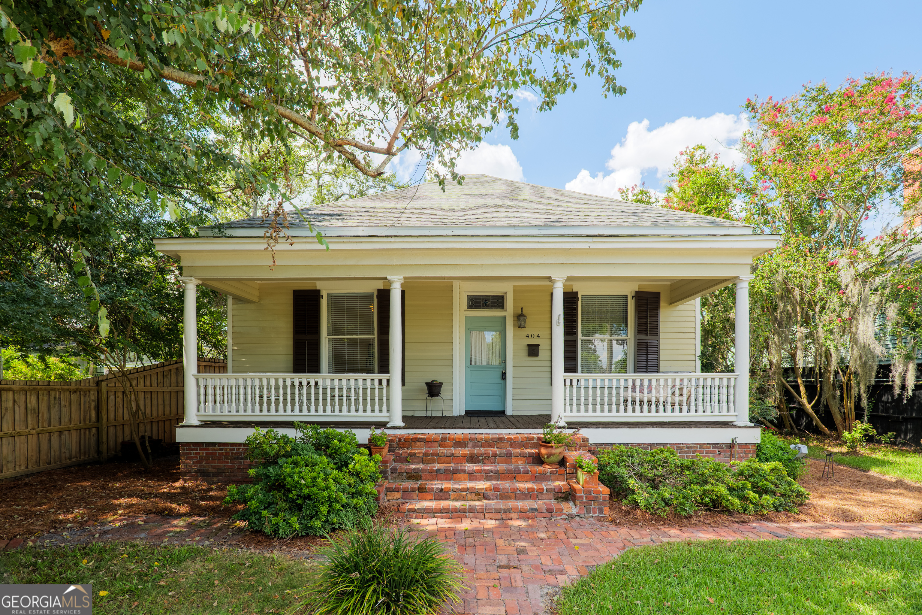 Welcome to this charming, spacious two-bedroom, two-bath home situated in the Fairview Historical District. You'll love the convenience of being a short walk away from vibrant downtown Valdosta, filled with bustling shops, a cozy coffee shop, wonderful restaurants, and unique boutiques. The property greets you with a front porch, perfect for morning, coffee. The stained glass above the front door adds a touch of charm. Step inside to discover 12-foot ceilings throughout and original hart pine floors throughout. Both bedrooms are large and filled with unique features, offering plenty of room for relaxation. The galley kitchen is both functional and stylish perfect for gatherings with friends and family. Outside the courtyard style backyard, accessible via a charming brick pathway, where you can enjoy outdoor gatherings, gardening, or relaxing. This home is a delightful blend of classic charm and modern comfort. Don't miss out on this unique opportunity!