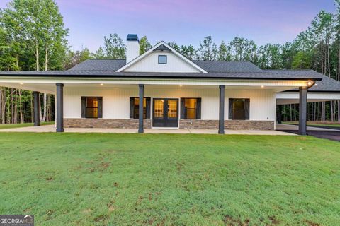 Photo of 7724 Georgia Highway 100, Buchanan, GA 30113 (MLS # 10622789)