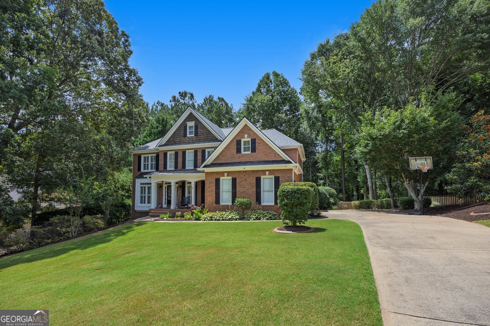 Welcome home to 109 Fairway Overlook, a stunning 3 sided brick home in the much sought after Bradshaw Farms Golf Community. Featuring 5 bedrooms, 4.5 baths, with a full finished basement, this home has lots of space, and plenty of updates. Walk into the 2 story foyer and you are met with fresh new paint throughout the main level. To the right is a spacious dining room and large office to the left, both with executive crown molding, highlighting the custom craftsmanship this home has to offer. The expansive 2 story living room features a fireplace & wall of windows that floods the space with lots of natural light. The open concept layout seamlessly connects the chefs kitchen featuring granite countertops, island and custom cabinetry. Hardwoods throughout, a half bath and custom built ins framing the fireplace finish off the main level. Upstairs you will find 4 bedrooms, and 3 full baths with new flooring and paint throughout. The primary bedroom features a beautiful tray ceiling, with generous space for a king size bed & sitting area, with a private en suite bath and spacious walk in closet. Walk down to the basement, which is an entertainer's dream. Finished with a built in bar, a second fireplace for added ambiance, a private home office, full bathroom and a dedicated space for a gym. Whether you are working from home, hosting, or recharging, this space offers unlimited flexibility. Enjoy the newly painted deck overlooking the large flat backyard, complete with a relaxing hot tub, perfect for unwinding after a long day. Every feature of this home has been thoughtfully designed with a perfect balance of comfort & style. The community features a 27 hole golf course with bluetooth enabled Yamaha Golf Carts, 2 pools, junior Olympic Sized pool, clubhouse, basketball and volleyball court, walking trails, multiple tennis courts and playground. This home and community have everything- all that's missing is you!