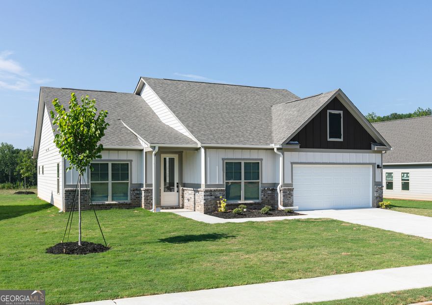 This beautiful 4-bedroom, 2-bathroom home features an open-concept layout with a spacious kitchen that boasts an impressive island, stainless-steel Whirlpool appliances, and 42" upper wood cabinets with crown molding-all part of the CompleteHome PlusTM package. The cozy dining area and open family room create an inviting space for entertaining, whether you're hosting game day or enjoying family dinners. The expansive primary suite comfortably fits a king-sized bed and offers a large walk-in closet and a private spa-inspired bathroom retreat. Additional bedrooms provide plenty of space for family and guests, while the laundry room doubles as a convenient mudroom, keeping your home organized and clutter-free. Curb appeal shines with a covered front porch and professionally landscaped yard, welcoming you and your guests. Other premium upgrades include tall ceilings, USB outlets, LED ENERGY STAR kitchen lighting, and a full suite of brand-new Whirlpool appliances, including refrigerator, stove, microwave, and dishwasher. Located in the desirable Mount Tabor Pointe community, 132 Cantrell Drive combines comfort, elegance, and value-ready for you to call home.  Color schemes vary by floorplan and elevation.