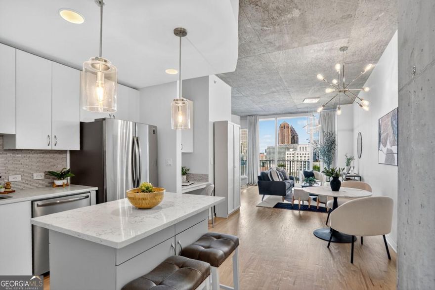 Experience the perfect blend of style, space, and location in this stunning Midtown retreat. This beautifully updated condo is a rare find-offering a seamless mix of modern touches and classic charm. The open-concept layout feels spacious and inviting, with oversized windows that flood the home with natural light and frame breathtaking views of the city skyline. Step into the sleek, updated kitchen featuring brand-new appliances and contemporary finishes, all set against the backdrop of rich hardwood floors that run throughout the home. Every detail is designed to create a warm, comfortable space that feels instantly like home.  Located in the heart of Midtown Atlanta-one of the city's most vibrant and walkable neighborhoods-you're just steps from Piedmont Park, acclaimed dining, shopping, MARTA, and easy access to major highways. Whether you're grabbing coffee, heading to the park, or enjoying a night out, everything is right at your doorstep. The building complements your lifestyle with resort-style amenities, including a luxurious pool, fully equipped fitness center, 24-hour concierge service, business center, gated parking, and secure key card access-offering convenience and peace of mind. Don't miss your chance to own this move-in-ready gem that captures the very best of Midtown living.