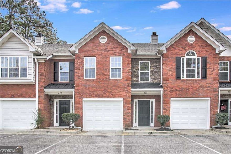 This beautiful renovated townhome offers all new luxury vinyl/laminate flooring throughout both levels, new interior paint, all new stainless steel appliances, beautiful granite countertops in kitchen and baths, new faucets, new light fixtures / ceiling fans, gorgeous large walk in shower with beautiful glass doors. Main level offers entry foyer, white kitchen with deep breakfast bar that feels more like an island, stainless steel under-mount sink, kitchen opens to family room with brick fireplace and dining area. Glass door opens out to your fenced backyard with concrete patio and large lawn area, fully fenced. Oversized primary bedroom upstairs with big walk-in shower, along with large secondary/2nd primary bedroom with tub/shower combo and huge closet. Townhouse has a single car garage, there are also 2 assigned parking spaces directly in front of the unit along with guest parking. Minutes to Downtown Woodstock, Roswell and Alpharetta. Close to Highway 92 and Interstate 75.