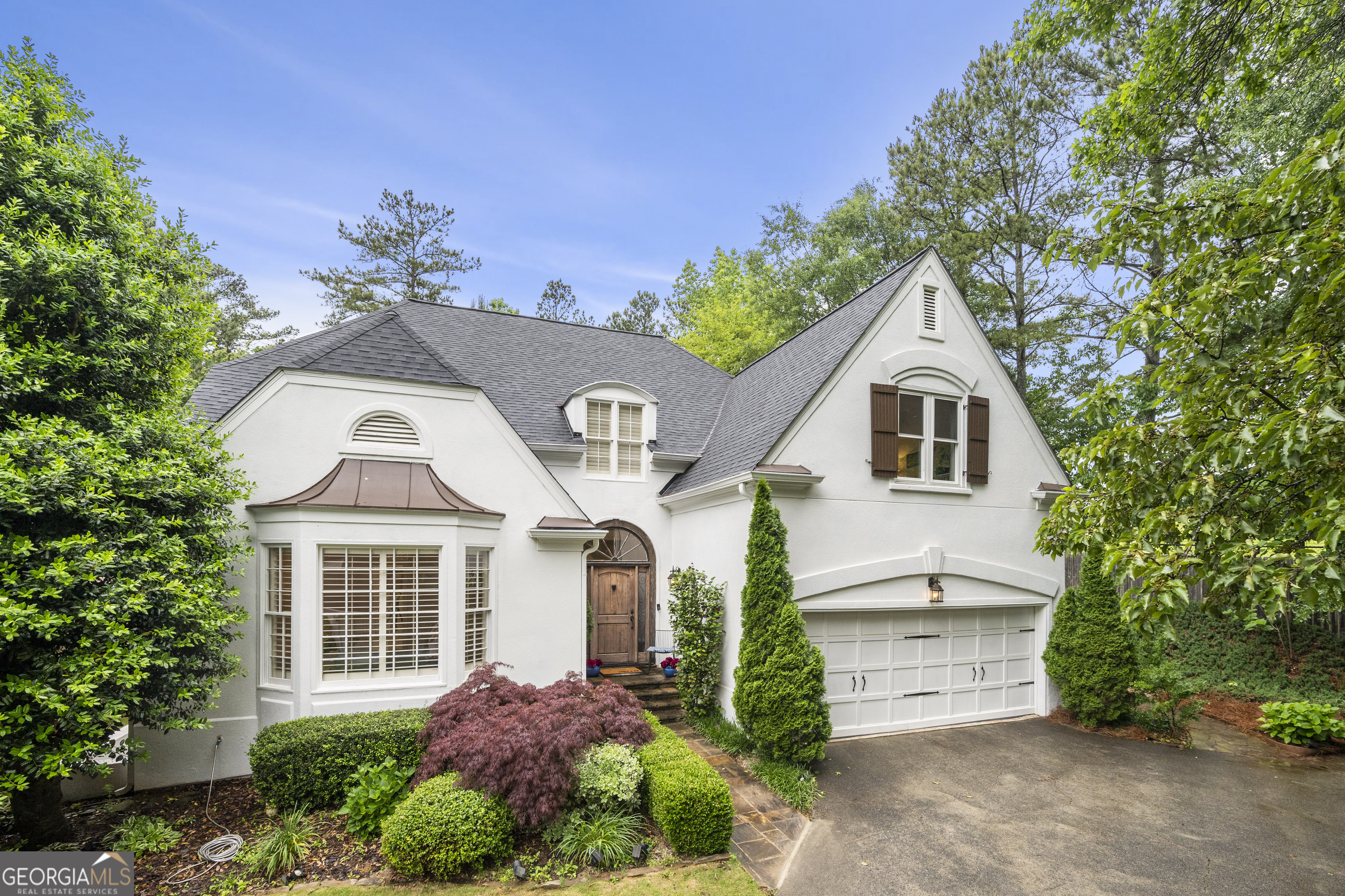 Beautifully Updated Home with Designer Touches, Top Schools & Ideal Location Welcome to this thoughtfully renovated and lovingly maintained home, nestled in a quiet neighborhood with top-rated schools and unbeatable access to shopping, dining, Atlanta or Airport. From the moment you arrive, you'll notice the attention to detail and the seamless blend of comfort, function, and modern elegance. Inside, you'll find a spacious master suite conveniently located on the main level, complete with a luxuriously remodeled master bath Coyour personal spa retreat. Upstairs features new hardwood flooring and two beautifully updated bathrooms, offering a fresh, timeless feel. Additional highlights include: *New roof installed in late 2021 *All electrical circuits updated *New water heater *Electric Vehicle Charger (ChargePoint) installed in 2024 *New windows in guest bedrooms upstairs The exterior was freshly painted in classic white, enhancing curb appeal, while the backyard has been fully remodeled into a private outdoor oasisCoperfect for relaxing or entertaining guests. This exceptional property combines tasteful upgrades, a versatile floor plan, and a fantastic location. Its the perfect place to call home move-in ready and waiting for you.