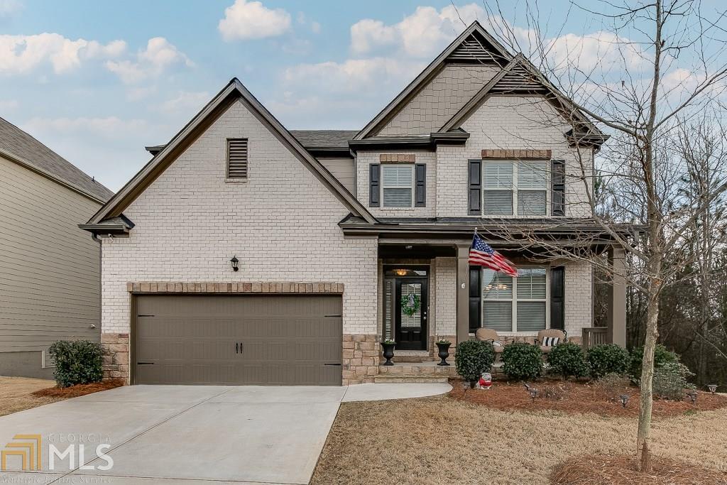 Gorgeous and Meticulously maintained 4 bedroom/3 Bath, 2 Car garage home on stubbed basement bath. A chef's kitchen with an oversized kitchen island that will seat six and overlooks the great room. The Butler's pantry has been extended for extra storage. Granite countertops throughout, tile backsplash. Hardwoods on main with fireplace, mudroom off the garage. Bedroom and full bedroom bath on main. Large and spacious owner's suite with sitting room, His and her walk in closet with access to upstairs laundry room. Deluxe tiled bath with separate tiled tub and shower. Huge open space on the second floor could be used as a theater, gameroom, classroom, office or a combination. Private fenced backyard and the cameras and security system will stay with the property. This address is minutes away from schools, Mall of Georgia, restaurants and I85.