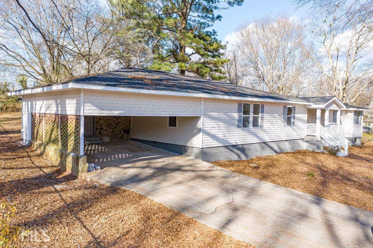 WOW! This property is spectacular & completely renovated. This 4 bedroom 2 bath ranch is move-in ready! Open floor plan w/bright & spacious kitchen to include beautiful granite countertops & new white cabinets, expansive breakfast bar overlooking dining room & family room. Enjoy entertaining in the huge family room that's open to kitchen & dining rooms. All new recessed lights and lighting fixtures throughout the property. The bathroom renovations are AMAZING boasting new vanities & beautiful tiled showers.The Mudroom/laundry/pantry is off the kitchen & is very roomy.You will fall in love with this renovated property with new windows, new plumbing, electrical and HVAC. Located downtown Villa Rica within walking distance to restaurants, schools, shopping and more. This one is a must see and will not last long.
