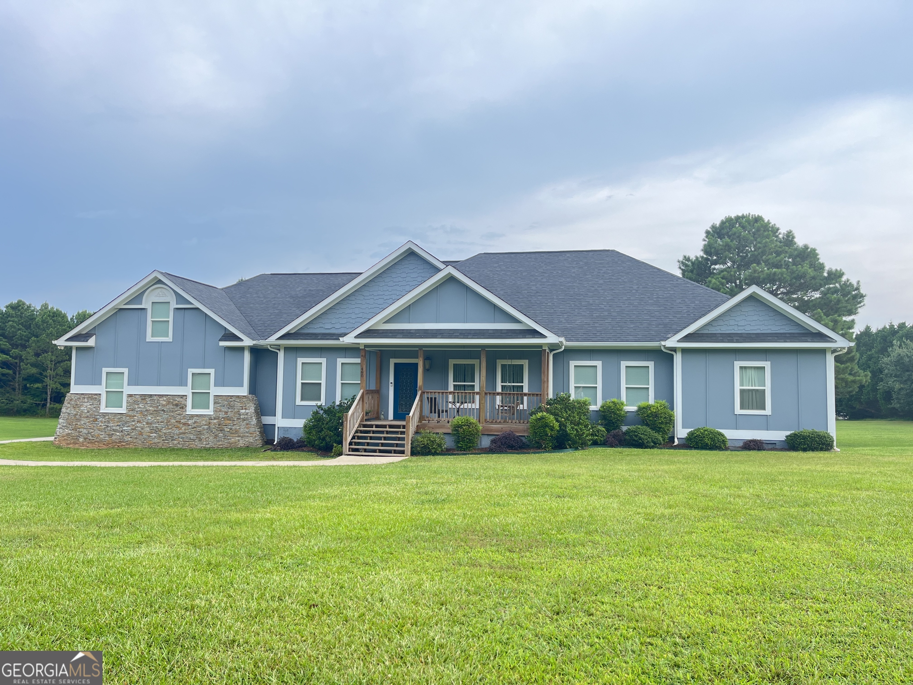 Built in 2017, this beautiful custom home offers the perfect blend of modern comfort and country living. Situated on four spacious acres, the property features 3 bedrooms, 2.5 baths, a dedicated office, and a large finished bonus room with its own mini split system-ideal for guests, theatre room, extra living space or could even be converted to a fourth bedroom. The open floor plan is designed for entertaining, with seamless flow between the living, dining, and kitchen areas. Ample walk-in closets throughout the home provide exceptional storage, and the walk-in attic adds even more convenience. This home is enhanced with stylish, upgraded light fixtures that bring warmth and character to every room. From statement pieces in the main living areas to elegant touches in bedrooms and baths, the lighting has been thoughtfully selected to complement the home's design while creating a bright, inviting atmosphere. Step outside to a spacious back deck, overlooking a private backyard, there is an exterior half bath on the deck making it perfect for outdoor entertaining, playtime, or when working in the yard. This home offers the best of both worlds-plenty of space inside and out, with thoughtful touches for modern living.