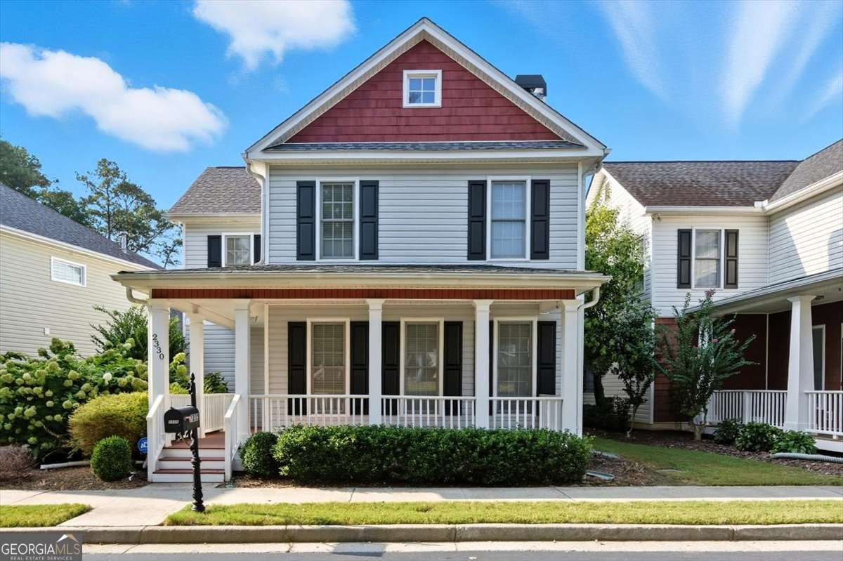 Charming Craftsman in Prime East Cobb Location Across from Community Park! You'll fall in love with this beautifully maintained craftsman-style home perfectly situated in a sought-after East Cobb neighborhood. Nestled directly across from the community's lushly landscaped park-complete with a pergola-covered sitting area, sidewalks, and charming old-world style lantern streetlights-this home offers both curb appeal and lifestyle. The inviting wrap-around front porch warmly welcomes guests, while the professionally landscaped front and back yards feature stone walkways and flowering shrubs that add to the home's charm. The flagstone back patio, surrounded by trellises and softscaping, provides an idyllic setting for morning coffee, evening wine, or al fresco dining. Inside, the open-concept main level features a fireside family room with custom built-ins, hardwood floors, and seamless flow into the dining area and kitchen. The eat-in kitchen is a chef's dream with granite countertops, stained cabinetry, stainless steel appliances, breakfast bar, and a sunny breakfast nook. A French door opens to the patio-perfect for entertaining! Upstairs, the spacious owner's suite offers a tray ceiling, walk-in closet, and a spa-like bath with dual vanities, separate soaking tub and shower, vaulted ceiling, and ceramic tile flooring. Two additional bedrooms share an updated bath with marble-tiled shower, seamless glass door, and ceramic tile floor. All bedrooms and the upper hallway feature hardwood flooring, and the laundry room is conveniently located upstairs. Additional highlights: Rear-entry two-car garage via alley access Community amenities include a pool, playground, sidewalks, and street lights. Just minutes to shopping, dining, Historic Marietta Square, Truist Park, Kennesaw State University, and easy access to I-75/85-this home offers both comfort and convenience in one of Cobb's most desirable locations. Don't miss your chance to own this East Cobb gem!!