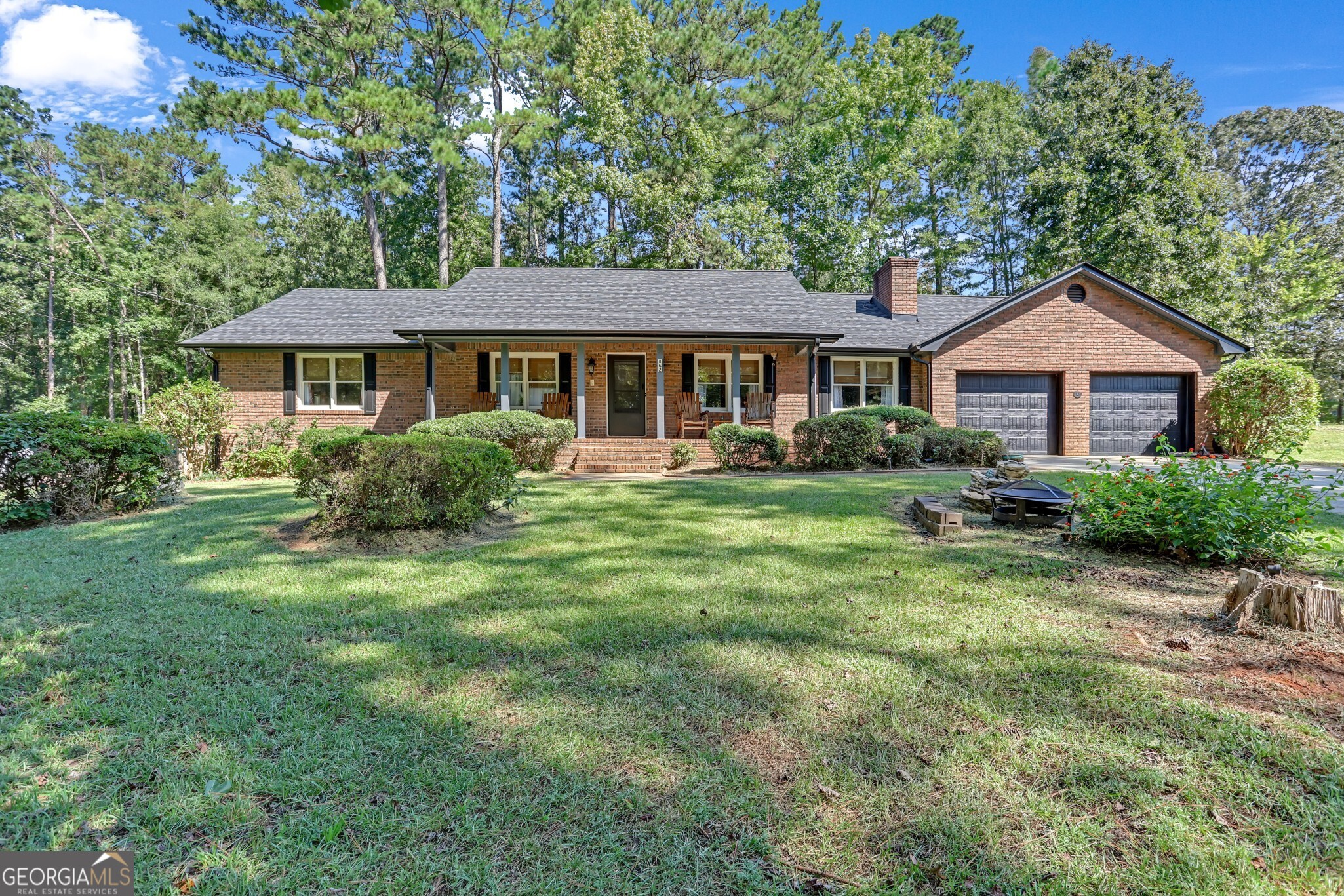 Stunning Brick Ranch with Over 2,050 Sq Ft! Updated kitchen with granite, tile floors, and breakfast area. Spacious family room w/ brick fireplace, large master suite w/ renovated bath, dual vanity, tile shower & garden tub. 4th room could be office/bedroom. Enjoy a 12x24 screened porch, shed & cook shack. Roof 5 months, central vac, irrigation, alarm, new garage doors & more!