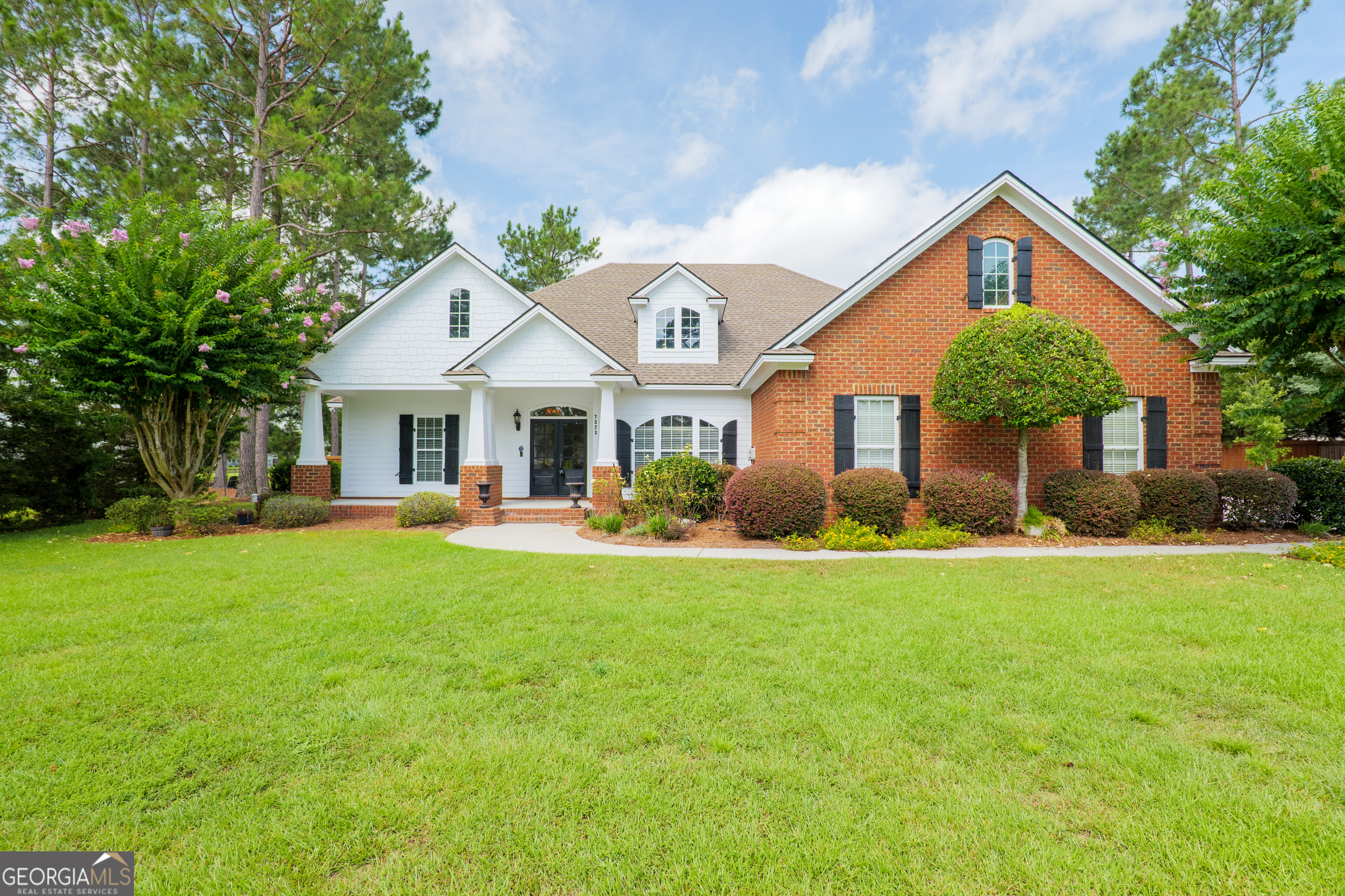 Welcome home to 7323 Mill Ridge Drive in the desirable Creekside West subdivision! This traditional-style property immediately captivates with its fantastic curb appeal. Step inside to a bright and spacious living room boasting tall ceilings, built-in shelving, a cozy fireplace, and beautiful LVP flooring. A generous formal dining room provides the perfect setting for hosting friends and family. Discover the heart of the home in the chef's kitchen, featuring attractive wood cabinetry, granite countertops, stainless steel appliances, an oversized pantry, convenient bar seating, and a charming breakfast nook. A convenient half bath is also located in the living area. Unwind in the private owner's retreat after a long day, complete with its own luxurious ensuite: a tile shower, relaxing soaking tub, dual vanities, and a spacious walk-in closet. Three additional bedrooms on the opposite side share a well-appointed bathroom. Enjoy the outdoors from the lovely screened porch or the fully fenced backyard - perfect for pets or play! Creekside West residents also enjoy two community pools, a playground, a fishing pond, and a walking trail. This exceptional home is conveniently located off I-75 within a top-rated school district. Don't miss out - schedule your tour today!