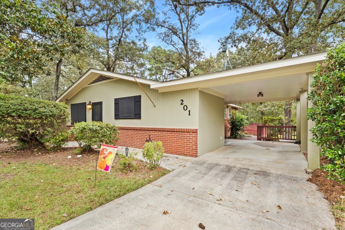 Welcome to 201 Marvin Blvd, an impeccably maintained, single-owner home that perfectly blends timeless character with modern comfort. This all one-level residence has been thoughtfully updated while keeping its original charm intact, creating a warm and inviting atmosphere from the moment you step inside. You will love the refinished hardwood floors that shine throughout, the plantation shutters that add elegance and privacy, and the overall care and attention that is evident in every detail. The spacious living areas flow beautifully, making it ideal for both quiet evenings and entertaining. Step outside to the large deck, overlooking an expansive backyard that feels like your own private retreat. A wired workshop sits in the back, ready for hobbies, storage, or creative projects. Recent improvements include a tankless water heater and several modern touches that enhance convenience while preserving the home's original character. Situated in a prime Warner Robins location, this property offers a quick commute to Robins Air Force Base, and is just minutes away from great shopping and dining options.
