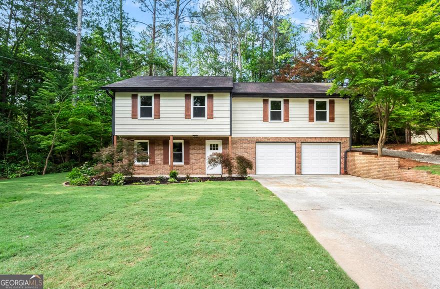 Don't miss out! Stunning raised ranch in the Hillgrove School district for under $400K. This newly renovated home is warm and inviting. The floor plan is open with tons of natural light. Other features of  include a rocking chair front porch, new flooring, fresh paint, completely new kitchen with solid surface countertops, stainless steel appliances, new lighting and plumbing fixtures, dining area, great room, family/den with brick fireplace, separate laundry, new garage doors, new shutters, and much more. Enjoy the new sodded front yard, or entertain on the private oversized back deck.  If you love Japanese Maples, this is the place for you! No HOA. Minutes to shopping, schools, parks and recreation.