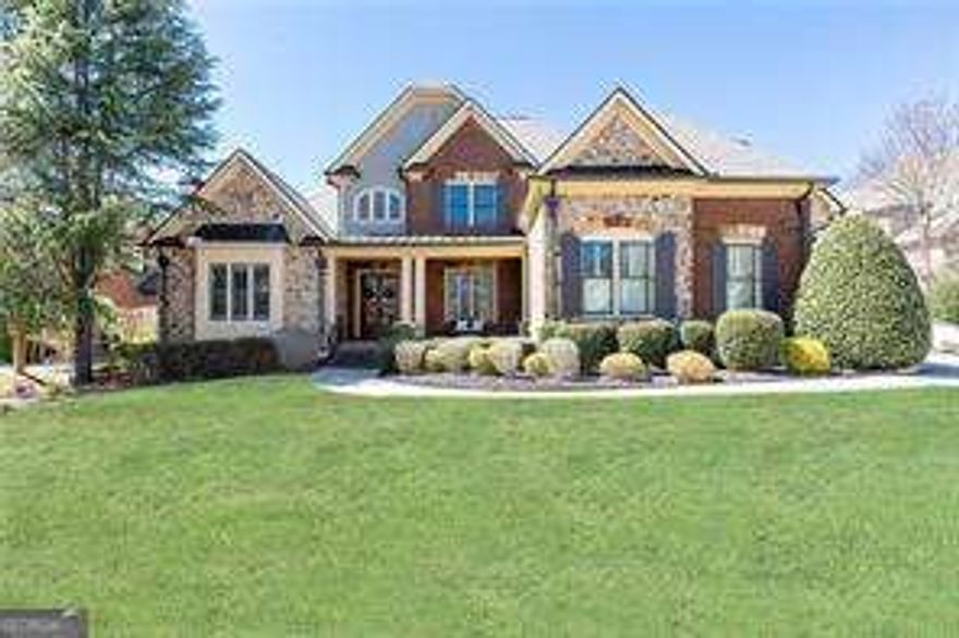 Located in the gated community of Winthrop Park, this stunning home offers exceptional craftsmanship and modern elegance. Recently updated with a newer roof and recently refinished hardwood floors throughout, this residence showcases exquisite molding and architectural details.  The oversized primary suite is conveniently located on the main level, while the upper floor features three spacious en-suite bedrooms. The gourmet kitchen is a chefCOs dream, boasting sleek stainless-steel appliances, a custom backsplash, and a walk-in pantry, all seamlessly flowing into the family room with soaring ceilings, built in bookshelves and a striking fireplace.  Step outside to a covered porch with a cozy fireplace, perfect for year-round entertaining while overlooking the beautifully landscaped backyard.  The finished terrace level is bathed in natural light and offers a spacious family room, an exercise room, an in-law suite with an additional bedroom, two full bathrooms, a kitchenette, and ample storage. Situated in a prime Johns Creek/Alpharetta location, this home is just minutes from top-rated schools, fine dining, and premier shopping, offering the perfect blend of luxury and convenience.