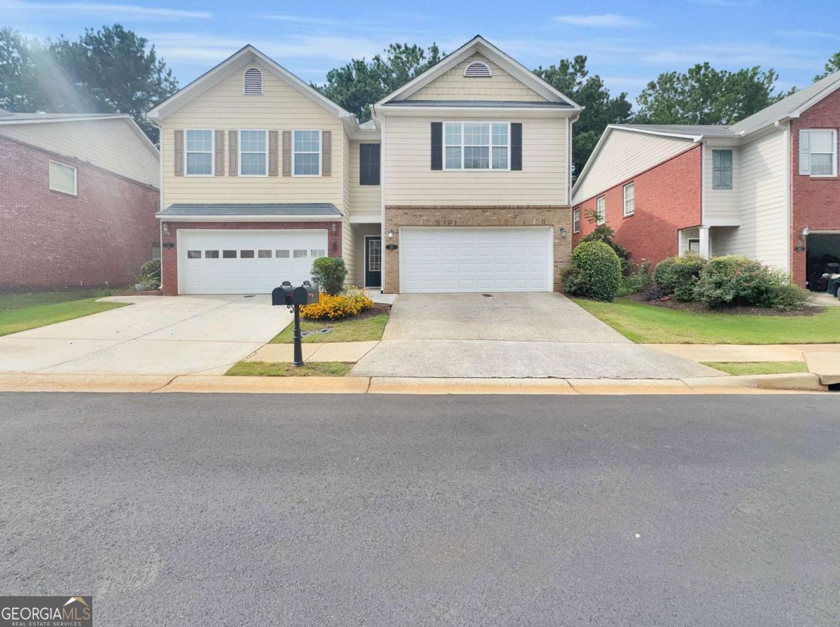 Welcome to this beautifully maintained 3-bedroom, 2.5-bath townhouse located in a desirable gated community with easy access to the interstate-perfect for commuters! Enjoy peace of mind with newer major systems including HVAC, hot water heater, refrigerator, range, and dishwasher. The home features fresh, neutral paint throughout the main living areas, creating a bright and inviting atmosphere. With a spacious two-car garage and room for two more vehicles in the driveway, parking is never a problem. Don't miss your chance to own a low-maintenance home in a prime location!