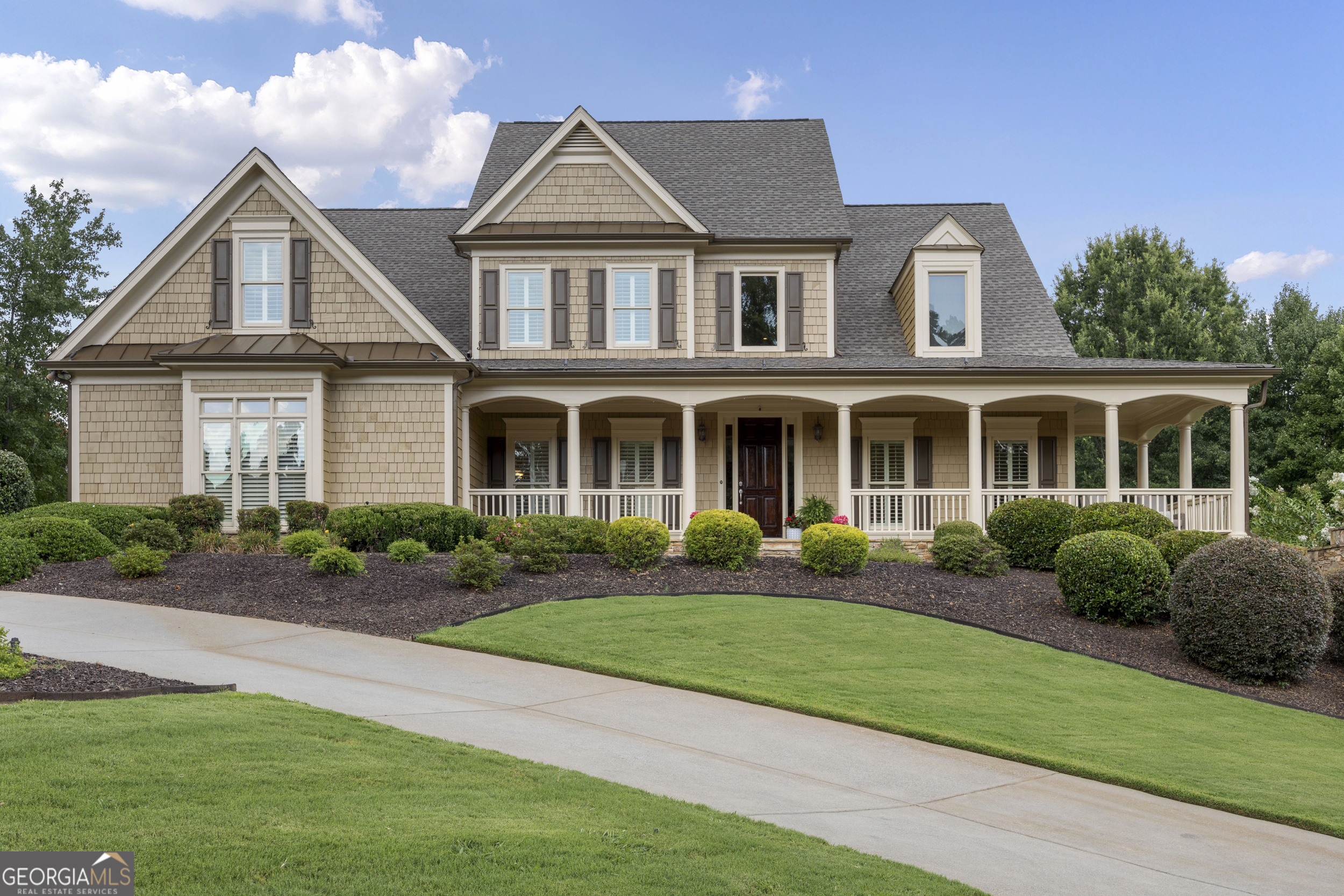 BEST CORNER LOT IN ALL OF WEST COBB!! One of the largest homes in the whole subdivision. This home offers luxury, space, flexibility, and unbeatable curb appeal-all in one of West Cobb's most desirable neighborhoods! This stunning 6BR / 5.5 BA luxury home sits on a premier corner lot and boasts a full finished basement. Over 6700 sf of beautifully appointed living space. Parking? No problem. Circular and linear driveway leads to a 3 car garage. You will never complain of not enough space with this home. Recent complete exterior paint. Updated roofing. Professionally landscaped with a WELL to water whenever you like, for how long you like. Enter this home through a 8-ft tall solid wood door into the grand 2 story foyer large enough to be a room of its own. HARDWOOD FLOORING throughout the main level except the bedrooms. To the right and left of the foyer is a very spacious dining room, large enough for a 10 seat dining table, and the living room with COFFERED CEILING. Can be used as an office. Both rooms have large blade SHUTTERS and get great sunlight. ALSO ON THE MAIN LEVEL ARE THE PRIMARY SUITE AND JR. PRIMARY SUITE. 2 BRs ON THE MAIN LEVEL!!!! Perfect for guests and in-laws. The Primary suite bath has been recently updated with modern SPA features. The Jr primary suite has a trey ceiling, garden tub and separate shower bath. The open 2- story family room features bookshelves, storage, and a masonry FIREPLACE with gas starter for beautiful fire lit nights watching a movie. The family room leads out to the screened enclosed deck with enough sitting room for outside entertaining (cable outlet), and the uncovered deck. ***A CHEF's KITCHEN. All stainless steel Jenn-Air appliances. Double convection oven. 6-eye gas cooktop. Oversized range hood. Center Island is perfect for preparing and serving guests. Lots of counter space. Tons of recently updated cabinets with champagne gold fixtures and under cabinet lighting. An abundance of cabinet storage surrounds the kitchen. Granite countertops with tile backsplash. Champagne gold water fixture. Breakfast area for 4-6 people and breakfast bar that seats 3-4 people. If all the cabinets are not enough storage, there is a walk-in pantry for large appliances and food storage. From the pantry is the laundry room on the main level located at the garage door and the side exterior door. ***2nd Floor features: Wood railing with wrought iron spindles and hardwood flooring across the bridge that overlooks the 2 story family room and foyer. BR#3 is oversized with a vaulted ceiling, walk-in closet, and full bath. Big enough for a jungle gym and bunk beds!! BR#4 is a large room over the garage with a large walk-in closet. BR#5 has a walk-in closet and access to the full bath. BR#6 is on the far end of the bridge with a closet. Can be used as a BR or office. ***FULL FINISHED BASEMENT "THE MAN CAVE" This basement is an entertainer's dream. Media Room, Exercise Room, Sitting room with fireplace, Game room with BAR, Full KITCHEN, Bonus room, Full bath with shower tub combination, and Utility room. The basement features heavy crown moulding throughout. Coffered ceiling in the sitting area with a stone gas fireplace. Leads to the terrace level patio. The gaming room is large enough for any sized gaming table. Bar with sink, counter refrigerator and ice maker. Custom cabinets with granite countertops. Plenty storage for beverages and party favors. The media room is intimate with decadent trimming and surround sound system. The full kitchen is great for extra cooking space for the huge celebrations. More custom cabinets and storage galore!!! The bonus room has been used as a playroom and also as extra sleeping quarters for those extra guests. If you do not want to travel to the gym, there is plenty of space for workout equipment. The basement also has an oversized utility room to store all your lawn and utility work equipment.