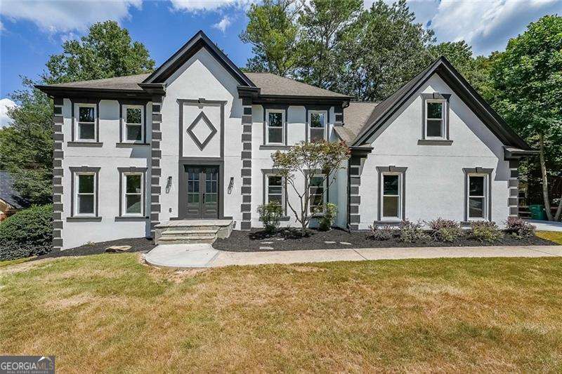 Beautifully Renovated 8-Bedroom Home in Prime Peachtree Corners Location Welcome to your dream home-completely renovated from top to bottom with stunning designer finishes throughout. Perfectly situated just 1.5 miles from the vibrant Peachtree Corners Town Center, this 8-bedroom, 4-bathroom home offers the perfect blend of space, luxury, and modern comfort in one of the area's most sought-after communities. From the moment you walk in, you'll be captivated by the bright, open floor plan, newly installed hardwood floors, fresh paint, and designer lighting that creates a warm, welcoming atmosphere. At the heart of the home is the show-stopping chef's kitchen featuring custom shaker cabinetry, a designer tile backsplash, stainless steel appliances, a gas cooktop, and a large center island-perfect for everyday living and effortless entertaining. The inviting family room with a custom fireplace flows beautifully into the sunlit dining area, with views of the private, level backyard. Whether hosting friends or enjoying a quiet morning, the peaceful sunroom offers the perfect retreat. The primary suite is a true sanctuary with cathedral ceilings, generous walk-in closets, and a spa-inspired en-suite bath complete with a soaking tub, oversized walk-in shower, and double vanity-every detail designed to feel like a luxury retreat. Upstairs, spacious secondary bedrooms offer flexibility for guests, home offices, or playrooms. This home is not only beautiful but also functional, with two brand-new HVAC systems and a new water heater for year-round efficiency and peace of mind. Located in a friendly swim and tennis community with a neighborhood pool, four lighted tennis courts, and a playground, you'll also enjoy access to top-rated schools including Simpson Elementary and Paul Duke STEM High School. Nearby private school options include Wesleyan, Cornerstone, and Greater Atlanta Christian. Plus, you're just minutes from concerts, movies, and dining at Town Center, with easy access to The Forum for shopping and restaurants. Commuters will love the quick access to I-285 and GA-400. Homes like this don't come around often-fully renovated, beautifully designed, and move-in ready in one of the most vibrant communities in metro Atlanta. Don't miss your chance to make it yours.