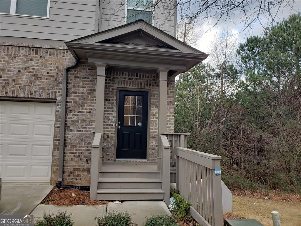 Excellent townhouse living in good location. Main floor has faux wood floors, open family room to kitchen, deck overlooking treeline on main floor, unfinished basement for storage, 3 bedroom up, with spacious master bedroom, one car carage with driveway for additional parking. Convenient to shops, restaurants and good schools. This community allows only 2 cars per unit.
