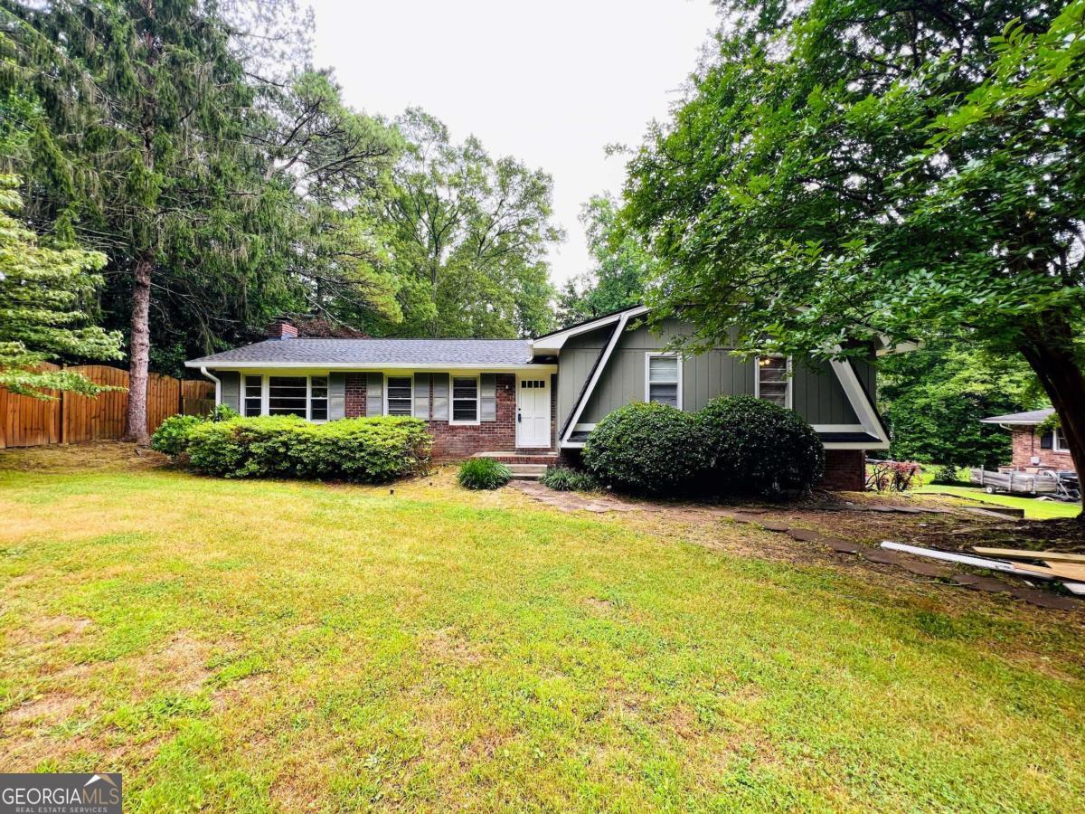 LASSITER HIGH SCHOOL DISTRICT! 4 Bedrooms, 2 Full Baths! HUGE Fenced Back Yard! Fabulous Cobb County Schools! 4th Bedroom and Recreation Room in Finished Basement! Family Room with Brick Fireplace! Separate Living Room...could be used as Formal Dining Room! White Eat-in Kitchen Overlooks Private Back Yard! Storage Building in Back! Master Features Private Bath! 1/2 Acre Private Wooded Lot! Pets will be considered on a per pet basis. Additional Pet Deposit assessed upon application. Available for immediate occupancy.