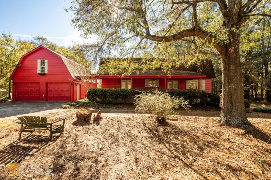 Spacious home in sought after neighborhood and school district. Hardwood floors on main level. Two story soaring ceiling in family room with brick fireplace plus built-in bookcases. Kitchen offers separate oven and drop in stove and lots of cabinet space. Large breakfast area and pantry. Convenient, spacious master on main with ceiling fan and walk in closet, two additional bedrooms up, and double sink in hall bath. Deck looks out to private and beautifuly landscaped backyard with out-building. Home includes two car garage and upstairs bonus room. Must see home!