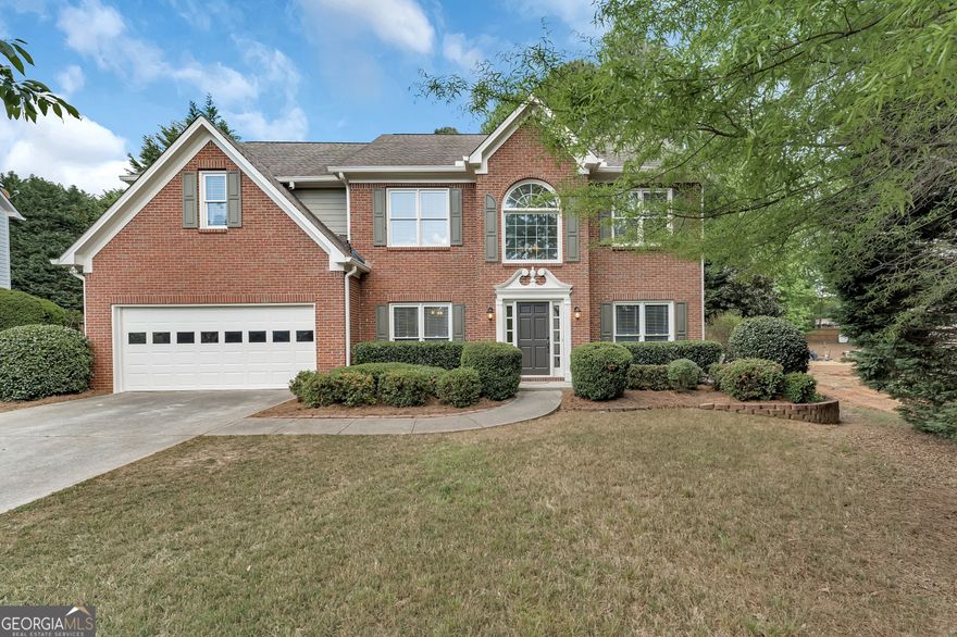 Brick-Front Traditional in Sought-After Windrose! Perfectly positioned just minutes from Halcyon, premier Shopping and Dining, and Top Forsyth Schools, this beautiful home offers the best of both worlds a Coveted Alpharetta Address with Low Forsyth County Taxes. Step inside the Two-Story Foyer Entrance to find a Formal Living Room with French Doors to the right -- ideal for a Home Office, Playroom, or Bedroom -- and a Formal Dining Room with a Tray Ceiling and Wainscoting to the left. The Bright, White Kitchen features Granite Countertops, a Tile Backsplash, and a Sunny Breakfast Room overlooking the backyard. The Fireside Family Room offers the perfect gathering space for relaxing or entertaining. A Powder Room and Laundry Room complete the main level. Upstairs, retreat to the Oversized Owner's Suite with a Tray Ceiling, Walk-In Closet, and a Spacious Ensuite Bathroom boasting Dual Vanities, a Soaking Tub, and a Separate Shower. Three additional Secondary Bedrooms and a Large Bonus Room share a Full Hall Bathroom, providing plenty of room for family or guests. Outside, enjoy an Expansive Patio overlooking a Fully Fenced, Grassy Backyard ideal for outdoor dining, play, or pets. With its prime location and timeless appeal, this Windrose home offers the perfect balance of Comfort, Convenience, and Community Living.