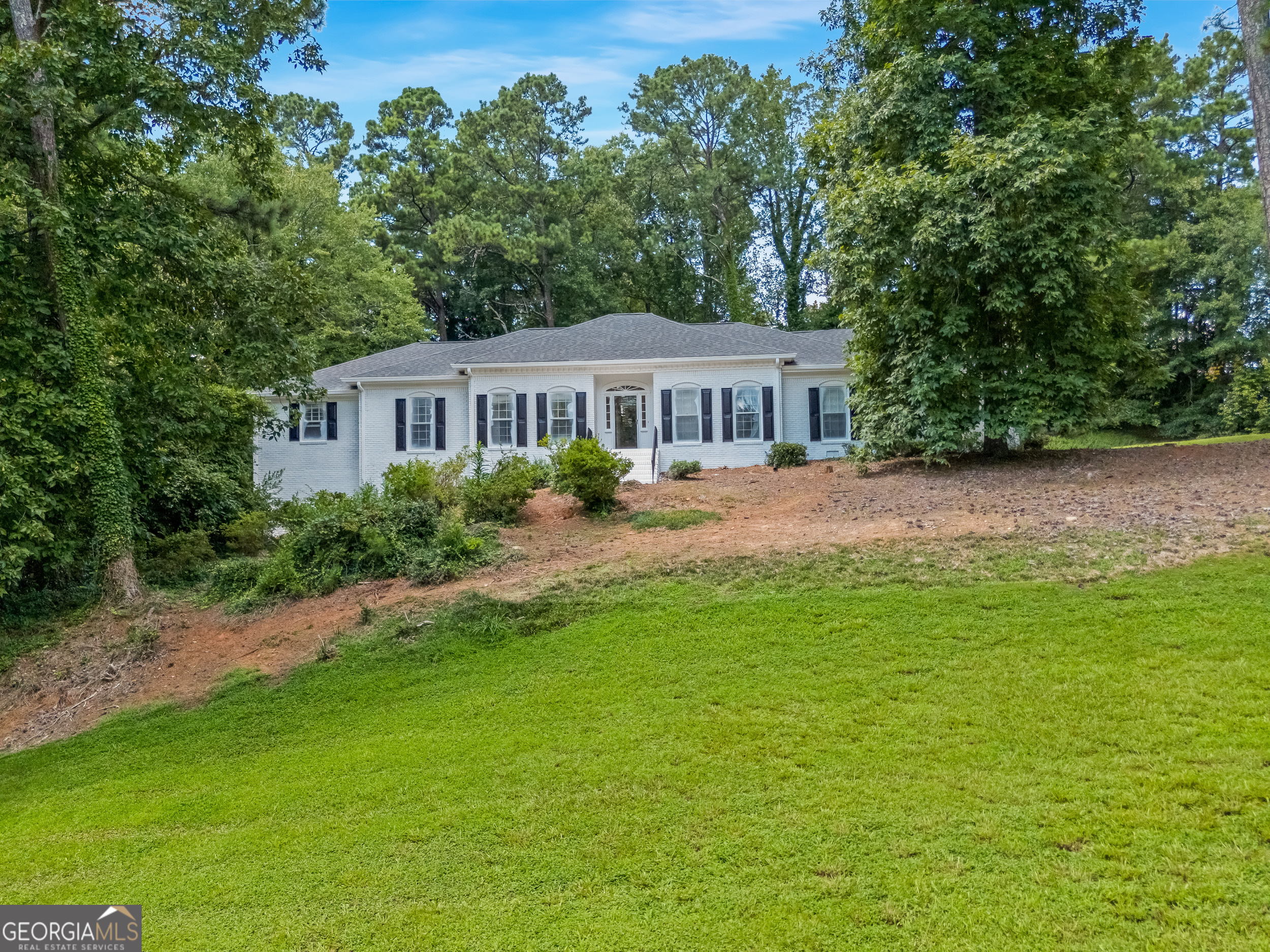 This luxury 6-bedroom, 4-bath home in Huntcliff is actively being renovated and under construction. Come with a visionary eye of what this beautiful home will become, so that you can make it your own. Set on a picturesque corner lot of over an acre with a level driveway and scenic views, the home will feature hardwood floors throughout. It also has a full basement and a screened-in porch overlooking the backyard. Located near the front of the neighborhood off Roswell Road, you'll enjoy quick access to all that Sandy Springs has to offer. As a resident of Huntcliff, you'll also enjoy resort-style amenities including a clubhouse, Olympic-size pool, tennis courts, and an equestrian center. With renovations underway, this home is full of potential-schedule your tour today to explore the possibilities!