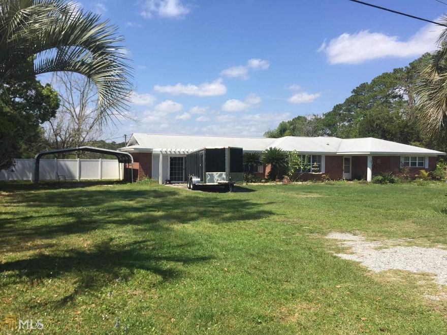 Possibly the only home in St Marys with a horse barn, complete with 6 stalls and marsh and creek frontage! Wow! Hurry and scoop this one up before the opportunity is gone. This 3 bedroom and 2 bath traditional ranch home is gorgeous. Brick exterior, newer roof, new windows, updated kitchen with built in appliances and a breakfast area. The den is off the kitchen peninsula. Separate spacious formal living room. Formal dining room. A bonus office as well as another larger bonus room with space to make your own. (Previously a game room.) Indoor laundry room. Barn has a full office or workshop with bathroom, full feed room and tack area, hay storage area, automatic waterer's. Round pen and wash rack/ standing area is included. Landscaped yard complete with fruit and flowering trees. A real opportunity here. Schedule your appointment today.
