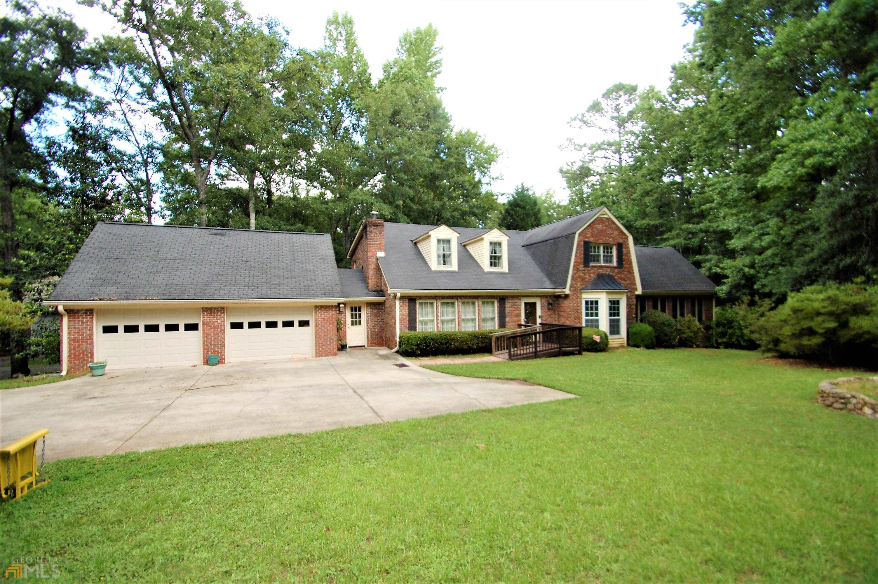 Tim "The Tool Man" Taylor or a person that has a car hobby will be living in bliss at this wonderful home!!! 5 private acres in one of Coweta County's premier locations. Just minutes to Peachtree City and just far enough away but very close to the new Publix and ancillary buildings at the Sams and Costco intersection. Easy access to I-85 as well and now in the Northgate High School district. This home has lots and lots to offer. The first detached garage is 40x50 and has a bathroom and an upstairs area that is currently unfinished but has unlimited potential. The second workshop is 40x40 and also has just unlimited potential for the uses that it could have as well. The land has lots of healthy trees that provides the privacy from the other neighbors. This is a must see property! Call your agent or Steve today to set up your private showing.