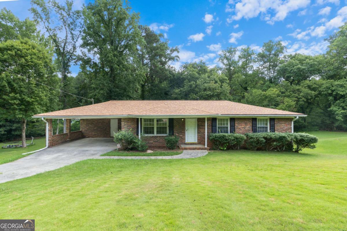 Charming Brick Ranch with Endless Potential! This 3-bedroom, 1.5-bath home offers classic charm and a solid brick exterior on a spacious lot. Step inside to find an updated hall bathroom and original details throughout. Enjoy mornings or evenings on the screened-in back porch with a ceiling fan-perfect for relaxing or entertaining. Conveniently located near major interstates, the mall, and a variety of dining and shopping options. While the home needs some updating, it presents a great opportunity for personalization and value-add improvements. Ideal for first-time buyers, investors, or anyone looking for a home with character and convenience.