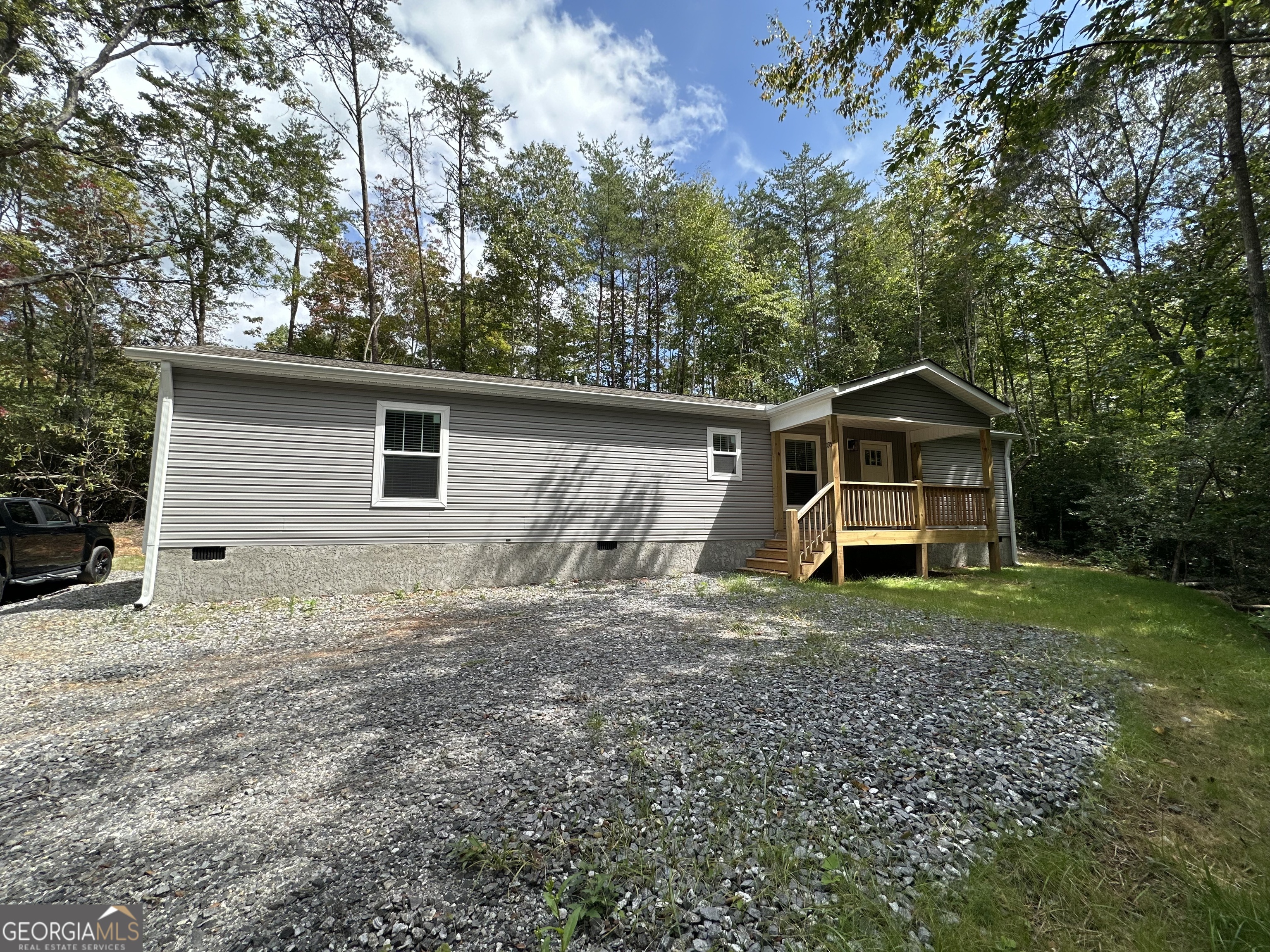 2 Bedroom 2 Bath on 0.88+/- in a beautiful community is finally here! With all NEWER Appliances. Fiber Optic now available! This beautiful lot features mountain laurel, and a beautiful water feature! Nicely Oaks is located near the Ingle's Grocery in Hayesville, and is very close to Chatuge Boat Ramp, Chatuge shores for the avid golfers, 30 min +/- from the Casino in Murphy! (some photos of nearby amenities/sights to see that are not in Nicely Oaks community are included in the listing) This is a must see- beautiful scenery, an abundance of wildlife , mountain views, and a gorgeous water feature! This home has beautiful drywall throughout, DuraCraft Cabinets, Frigidaire stainless steel appliances ( * * everything but furniture, microwave & washer & dryer * * ), Craftsman style front door, Ecobee Smart Thermostat, double pane windows & window treatments, w/ 2 in blinds, and carrier Furnace. Enjoy your Heavy Duty, freestanding deck for gatherings and BBQ's! The home also features a covered portico! The 3D walkthrough is photos from another Unit in the community. Some photos have been digitally enhanced. Buyer should verify sq ft, 3d walk through/measurements may not be 100% accurate. Home is not selling furnished, 3D walk through is of a home in community that is identical to this model) This community is minimally restricted. Light annual fee of $295+/- for rd maintenance and shared well, Schedule a viewing today! **Priced to sell! Will finance FHA/VA and most loan types, multiple homes that have been sold in community were financed.** 710 Nicely is the best way to locate, since address is newer, it will not show in maps! Turn rt at mailboxes