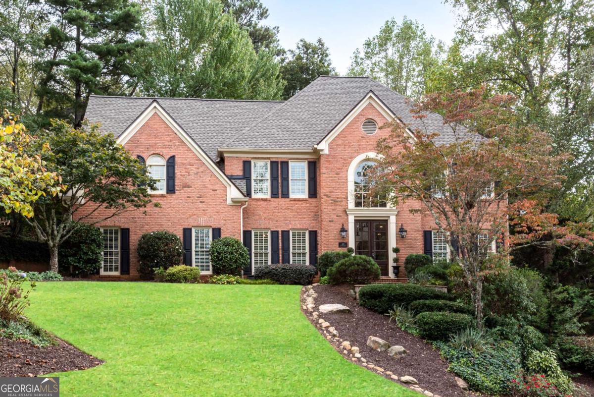 Nestled in the Highly Sought-After Active Swim/Tennis and Lake Community of Hampton Woods in East Cobb / Walton HS This Stunning Custom-Built Brick Traditional Home Offers Luxury Living on Three Beautifully Finished Levels - Including a Fully Finished Terrace Level. With 5 Spacious Bedrooms and 4.5 Bathrooms, Every Detail of This Home Has Been Thoughtfully Designed and Meticulously Upgraded. Step Through Elegant Double Front Doors Into a Grand Two-Story Foyer That Opens to the Formal Living and Family Rooms. Gleaming Hardwood Floors Flow Throughout the Main Level, Enhancing the Timeless Appeal of the Home. The Heart of the Home Is the Chef's Kitchen, Outfitted With High-End Custom Shaker Cabinetry, Quartz Countertops, and Premium Appliances Including a Sub-Zero Refrigerator, Wolf Gas Cooktop With Down Vent, KitchenAid Wall Oven, Two Bosch Dishwashers, and an Apron Front Sink. The Open-Concept Layout Connects the Kitchen to the Breakfast Area and the Inviting Family Room, Which Features a Gas Fireplace, Custom Built-Ins, and a Stylish Wet Bar With a Wine Fridge and Sink - Perfect for Entertaining. Enjoy Seamless Indoor-Outdoor Living With Direct Access to the Private, Beautifully Landscaped Backyard, Complete With Low-Maintenance, Pet-Friendly Turf and a Designated Playground Area. Multiple Outdoor Entertaining Spaces Make It an Ideal Spot for Gatherings, Barbecues, or Watching the Big Game With Friends. Elegant Touches Throughout Additional Features on the Main Level Include a Banquet-Sized Dining Room, a Designer Powder Room, and a Custom Office/Mudroom With Built-In Cabinetry and Desk Space Off the Garage Entry. Throughout the Home, You'll Find Premium Finishes Like Plantation Shutters, Custom Drapes, and Designer Lighting. Upper Level The Luxurious Owner's Suite Is a Private Oasis, Complete With a Spa-Like Bathroom Featuring a Soaking Tub, Oversized Glass-Enclosed Shower, and Dual Vanities. Two Secondary Bedrooms Share a Jack-and-Jill Bathroom, While the Fourth Bedroom Has Its Own Private En-Suite Bath. All Bedrooms Are Generously Sized, and Brand-New Carpeting Has Been Installed Throughout the Upper Level. Finished Terrace Level The Terrace Level Is an Entertainer's Dream With a Spacious Recreation/Media Room, Fireplace With Custom Built-Ins, and a Full Kitchenette/Bar. There's Ample Space for a Home Gym, Movie Nights, or Game Days, Plus a Private Guest Bedroom and Full Bathroom - Ideal for Overnight Visitors or Multi-Generational Living. Additional Highlights * Custom Upgrades Throughout: Cabinetry, Flooring, Lighting, and Finishes * Two Staircases to the Upper Level * Professionally Designed Backyard With Turf, Play Area, and Multiple Entertaining Zones * Located in a Top-Rated School District This Exceptional Home Combines Comfort, Elegance, and Functionality - All in One of East Cobb's Most Desirable Neighborhoods. Schedule Your Private Showing Today and Experience the Lifestyle That Hampton Woods Has to Offer! Elem: Mount Bethel, Middle: Dickerson, High: Walton