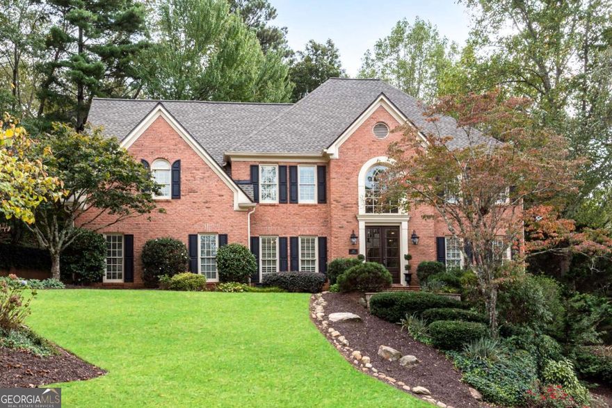 Nestled in the Highly Sought-After Active Swim/Tennis and Lake Community of Hampton Woods in East Cobb / Walton HS    This Stunning Custom-Built Brick Traditional Home Offers Luxury Living on Three Beautifully Finished Levels - Including a Fully Finished Terrace Level. With 5 Spacious Bedrooms and 4.5 Bathrooms, Every Detail of This Home Has Been Thoughtfully Designed and Meticulously Upgraded.    Step Through Elegant Double Front Doors Into a Grand Two-Story Foyer That Opens to the Formal Living and Family Rooms. Gleaming Hardwood Floors Flow Throughout the Main Level, Enhancing the Timeless Appeal of the Home. The Heart of the Home Is the Chef's Kitchen, Outfitted With High-End Custom Shaker Cabinetry, Quartz Countertops, and Premium Appliances Including a Sub-Zero Refrigerator, Wolf Gas Cooktop With Down Vent, KitchenAid Wall Oven, Two Bosch Dishwashers, and an Apron Front Sink. The Open-Concept Layout Connects the Kitchen to the Breakfast Area and the Inviting Family Room, Which Features a Gas Fireplace, Custom Built-Ins, and a Stylish Wet Bar With a Wine Fridge and Sink - Perfect for Entertaining.    Enjoy Seamless Indoor-Outdoor Living With Direct Access to the Private, Beautifully Landscaped Backyard, Complete With Low-Maintenance, Pet-Friendly Turf and a Designated Playground Area. Multiple Outdoor Entertaining Spaces Make It an Ideal Spot for Gatherings, Barbecues, or Watching the Big Game With Friends.    Elegant Touches Throughout  Additional Features on the Main Level Include a Banquet-Sized Dining Room, a Designer Powder Room, and a Custom Office/Mudroom With Built-In Cabinetry and Desk Space Off the Garage Entry. Throughout the Home, You'll Find Premium Finishes Like Plantation Shutters, Custom Drapes, and Designer Lighting.    Upper Level  The Luxurious Owner's Suite Is a Private Oasis, Complete With a Spa-Like Bathroom Featuring a Soaking Tub, Oversized Glass-Enclosed Shower, and Dual Vanities. Two Secondary Bedrooms Share a Jack-and-Jill Bathroom, While the Fourth Bedroom Has Its Own Private En-Suite Bath. All Bedrooms Are Generously Sized, and Brand-New Carpeting Has Been Installed Throughout the Upper Level.    Finished Terrace Level  The Terrace Level Is an Entertainer's Dream With a Spacious Recreation/Media Room, Fireplace With Custom Built-Ins, and a Full Kitchenette/Bar. There's Ample Space for a Home Gym, Movie Nights, or Game Days, Plus a Private Guest Bedroom and Full Bathroom - Ideal for Overnight Visitors or Multi-Generational Living.    Additional Highlights    * Custom Upgrades Throughout: Cabinetry, Flooring, Lighting, and Finishes    * Two Staircases to the Upper Level    * Professionally Designed Backyard With Turf, Play Area, and Multiple Entertaining Zones    * Located in a Top-Rated School District    This Exceptional Home Combines Comfort, Elegance, and Functionality - All in One of East Cobb's Most Desirable Neighborhoods. Schedule Your Private Showing Today and Experience the Lifestyle That Hampton Woods Has to Offer!    Elem: Mount Bethel, Middle: Dickerson, High: Walton