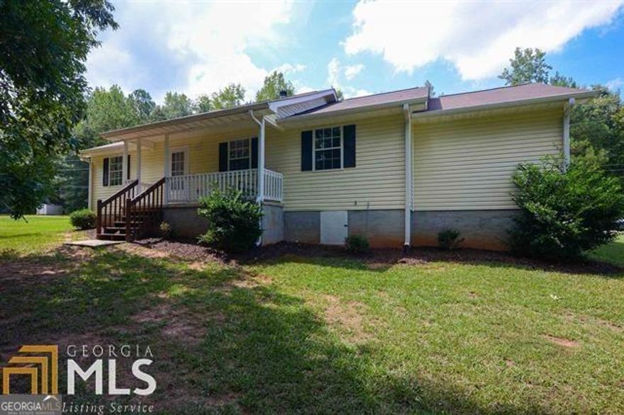 Welcome home to this move-in-ready home nestled on approximately 1.5 private acres in the highly sought-after Ola School District. This charming 3-bedroom, 2-bath home combines modern updates with peaceful country living, no HOA and plenty of space to spread out!  Step inside to find fresh interior paint, new flooring (with lifetime warranty), and a fireside family room perfect for cozy evenings. The updated kitchen features new countertops, and appliances, along with a bright breakfast/dining area overlooking your private backyard.  The split bedroom plan offers a spacious owner's suite with an updated bathroom featuring tile floors and stylish new fixtures. Both bathrooms have been refreshed from top to bottom, showcasing today's modern finishes. Enjoy relaxing mornings on the covered front porch or entertaining outdoors with ample yard space and an outdoor storage building for all your tools and toys. The attached garage adds convenience, while new interior lighting and fixtures tie everything together with a fresh, contemporary feel. All plumbing and electrical has been updated. This one checks all the boxes, updated, move-in ready, and zoned for some of Henry County's top-rated schools. USDA Eligible. Home is conveniently located only 7 minutes from the new Publix shopping center and local restaurants. Professional photos coming soon. Contact Amber and Company today for more information.