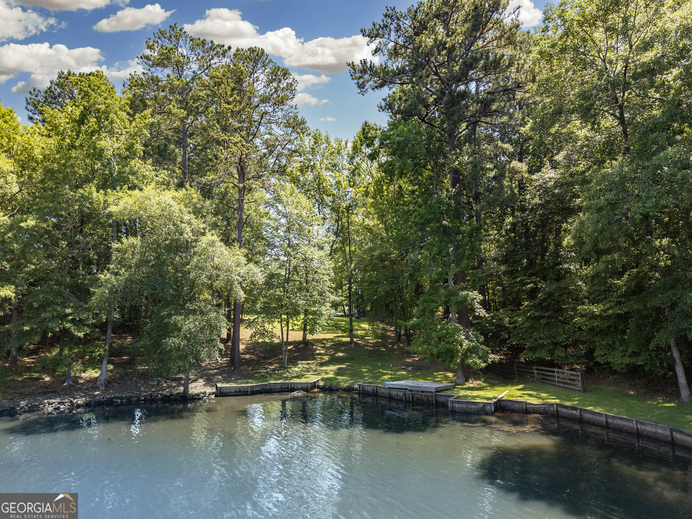 HUGE REDECTION. PRICE FIRM. Fabulous cleared lake lot on Sinclair! Fee Simple. Gentle slope to water - perfect for basement. End of quiet dead end cul de sac. Beautiful calm part of the lake. Some established landscaping in place. Deep well and older septic tank in place.