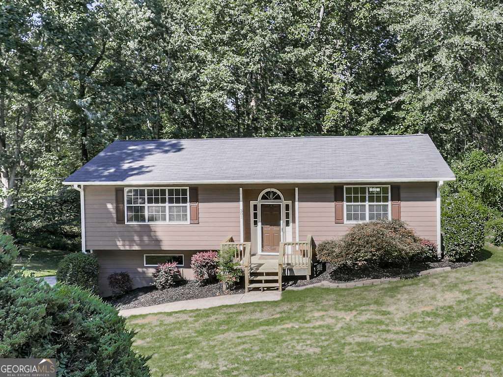 Beautifully Renovated 2 Bedroom, 2 Bath Home in the Heart of Holly Springs! Welcome home to this thoughtfully updated residence, ideally located on a spacious .60-acre lot in the highly desirable Holly Springs area. With 1,218 sq. ft. of finished living space and the potential for expansion, this property combines modern updates with unbeatable convenience. Step inside to a bright and welcoming interior featuring freshly painted walls and trim, stylish new fixtures, and brand-new flooring throughout! The split-level layout is designed for both comfort and functionality, with a generous living room that flows seamlessly into the open kitchen-perfect for everyday living, family gatherings, and entertaining friends. Each of the two bedrooms is a private retreat, complete with its own en suite bathroom, offering comfort and convenience rarely found in homes of this size. The lower level features a spacious two-car garage providing ample storage and easy access. Adjacent is the unfinished basement, a blank canvas ready to bring your vision to life-whether you imagine a third bedroom, private home office, fitness room, or versatile flex space, the possibilities are endless. Outside, the expansive lot offers room to enjoy outdoor living, gardening, or future improvements! Freshly painted Exterior and trim! Location is key, and this home delivers! Situated just minutes from local shopping, dining, and the exciting new Holly Springs Town Center, you'll love being part of this growing and vibrant community. Easy access to Interstate 575makes commuting a breeze and connects you quickly to Woodstock, Canton, and the greater Metro Atlanta area. With its combination of modern renovations, functional layout, future potential, and prime location, this home is truly a rare find in Holly Springs-don't miss the opportunity to make it yours!