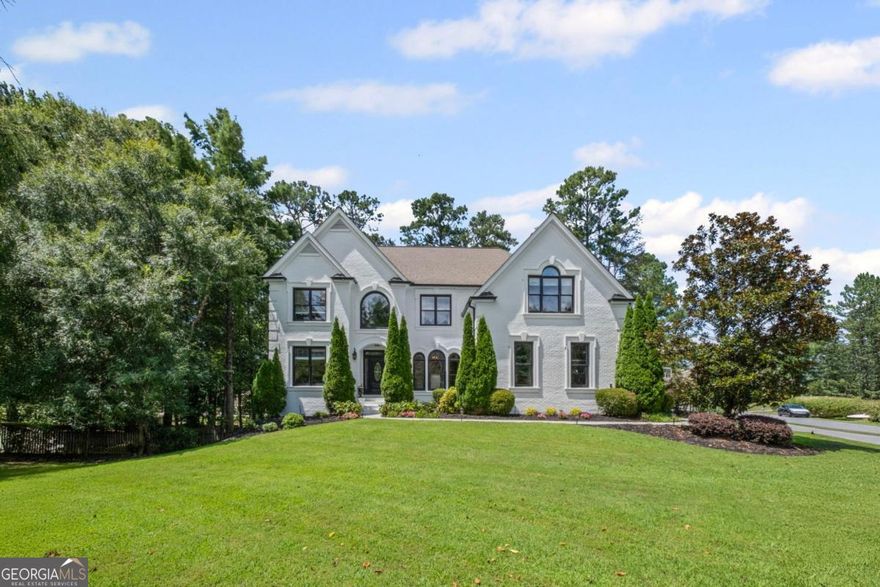 Welcome to your dream home in the heart of Alpharetta's most sought-after swim and tennis community. Minutes away from downtown Alpharetta. This beautifully updated residence offers the perfect blend of elegance, comfort, and functionality, ideal for modern living and entertaining. Features 6 bedrooms, 4-bathrooms and is filled with custom upgrades and thoughtful details throughout.   Step inside to discover freshly painted interiors and thoughtfully remodeled bathrooms that exude timeless sophistication. The chef's kitchen opens to a charming porch and an expansive deck that overlooks a lush, private backyard complete with a fire pit and trampoline for endless outdoor enjoyment.  The oversized master retreat is a true sanctuary, complete with a private sitting area and access to a serene screened porch-perfect for morning coffee or evening relaxation.  The spacious floor plan features generous living areas, including a fully finished terrace level with a guest suite and ensuite bathroom, an extra guest bedroom that could serve as a gym or secondary office, a home theater, and dining room.   Recent upgrades include a brand-new water heater, new deck, new garage floor.    This is more than a home, it's a lifestyle.