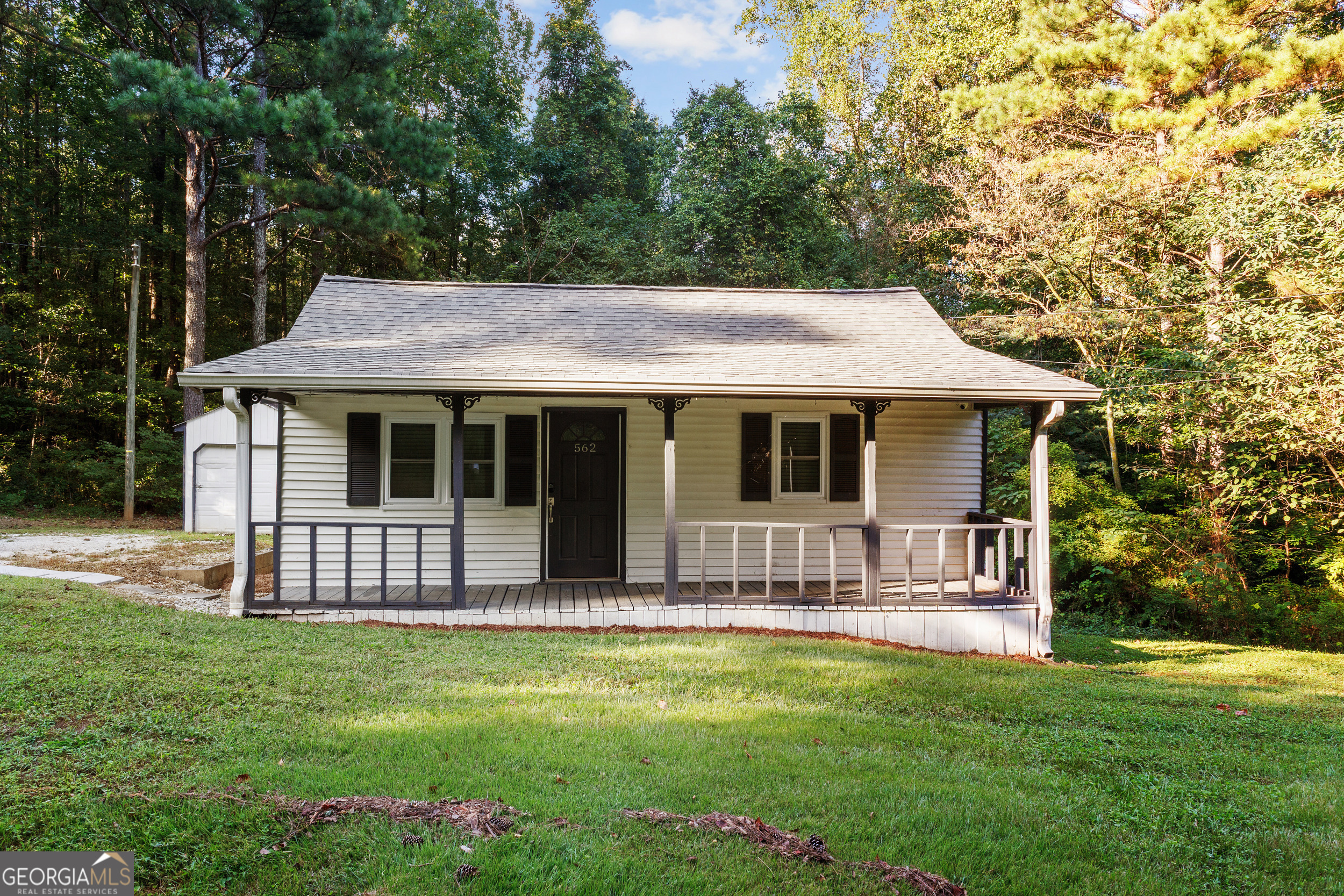 Enjoy this home on a large lot nestled in a great location . The home has a sitting front porch for all occasions and relaxing. Along with an updated kitchen. This is great home for the price and location. Home is sold as is. Do not wait see this one today.