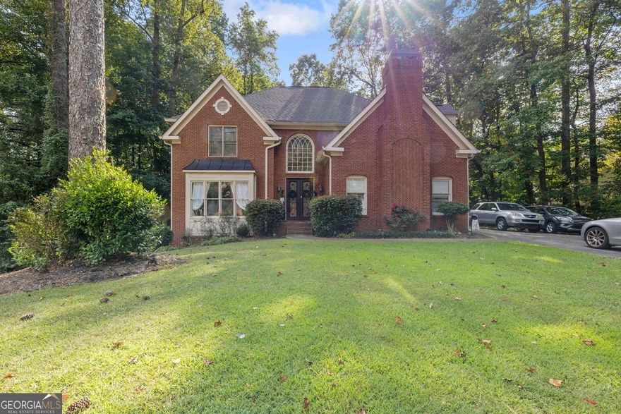 Nestled at the end of a cul-de-sac in a desirable Marietta HOA community, this updated brick home offers 3 bedrooms, 3 baths, and 3,080 sqft of living space on a private half-acre lot backing to a mature greenbelt. Originally a 4-bedroom layout, the home can easily be converted back. Major updates include a new roof, HVAC, and water heater (2022), while the kitchen and bathrooms were remodeled 5 years ago. Interior upgrades include refinished hardwood flooring, Italian marble in the master bath and living room, and fresh paint throughout. A side-entry double garage provides excellent storage. With access to community pool, tennis, and trails and located near top-rated schools, shopping, and dining, this home blends modern comfort with timeless appeal.