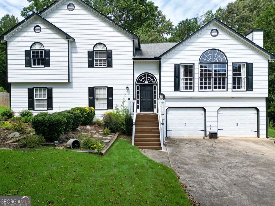 Step into this beautiful, move-in ready home! A spacious foyer welcomes you into the light-filled living room, highlighted by a striking stone-stack fireplace. The semi-open dining room flows seamlessly into the renovated kitchen, complete with granite countertops, a tiled backsplash, and crisp white cabinetry, perfect for everyday living or entertaining.  Enjoy cozy fall evenings in your four-season sunroom, which opens directly to a fully fenced backyard. Just beyond, a private hot tub retreat awaits, tucked beneath the shade of mature trees.  Inside, the large primary suite offers a relaxing ensuite bath with a soaking tub, double vanities, and a step-less shower. Two additional bedrooms and a full bath complete the upstairs level.  Downstairs, discover a versatile "in-law" or "teen suite" featuring an expansive bonus space, closet, and full bathroom. An expansive, fully fenced backyard is perfect for a pool, play set or for throwing the football.   With newer systems, appliances, and fixtures already in place, you can move in with peace of mind. Schedule your tour today and see everything this home has to offer!