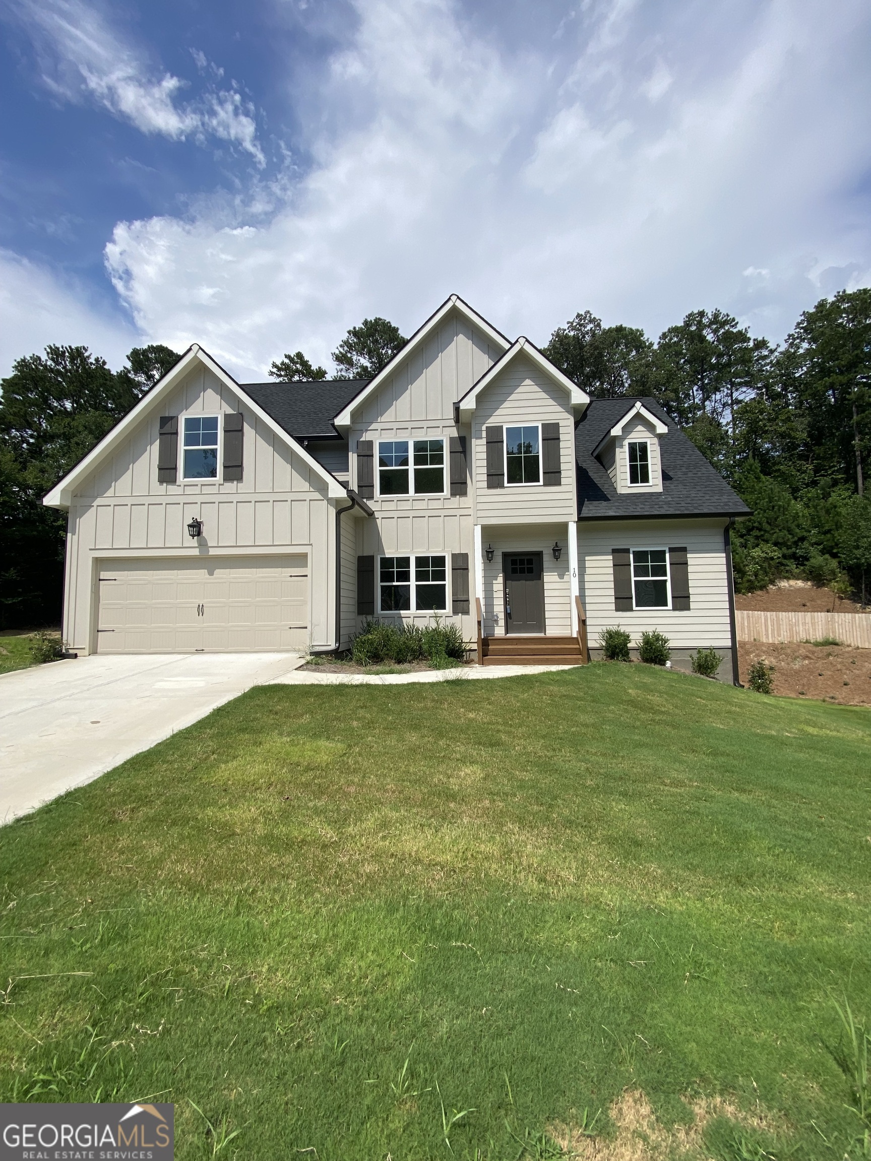 This new construction 4-bedroom, 2.5-bath home combines modern design with everyday comfort. Featuring a spacious open-concept kitchen and living room, it's the perfect spot for family gatherings and entertaining. A separate dining room adds space for special meals and celebrations. The primary suite on the main level offers convenience and privacy, while three additional bedrooms upstairs provide plenty of room for family or guests. The unfinished basement offers endless possibilities-create a media room, home gym, or extra storage space. Enjoy the outdoors on your back deck overlooking a peaceful yard, or take advantage of the neighborhood pool for summer fun. Nestled in a quiet cul-de-sac, this home offers both community and privacy in a sought-after location.